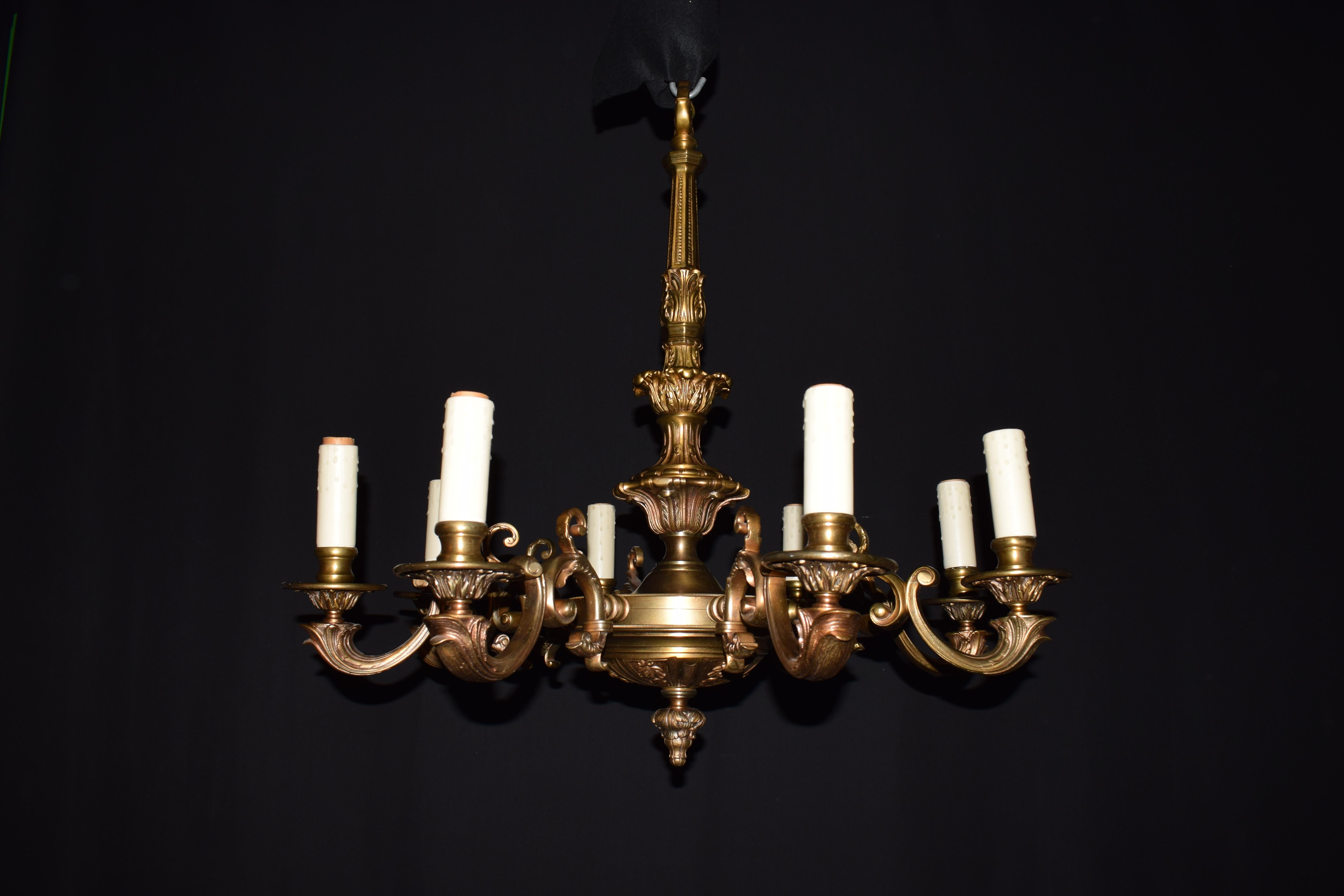 Regence style chandelier. Gilt bronze body issuing 8 