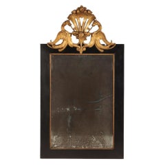 Régence style ebonized and giltwood mirror, C 1890.