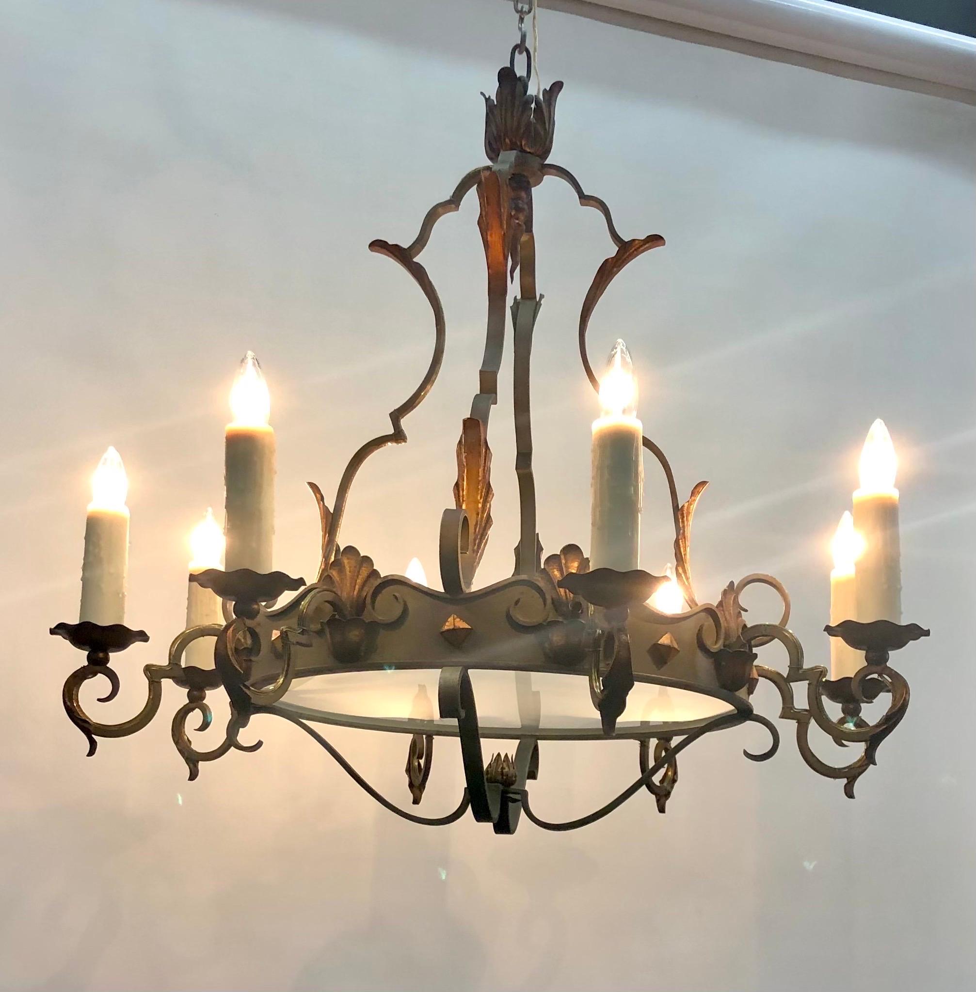 This Grand Elegant  Régence Style French Wrought Iron and Tôle Chandelier was made in the Early 20th Century.  The color of this Verde Wrought Iron with highlighted Lustrous Patinated Gilt Tôle mounts is amazing.  The Central Wrought Iron Tôle Ring