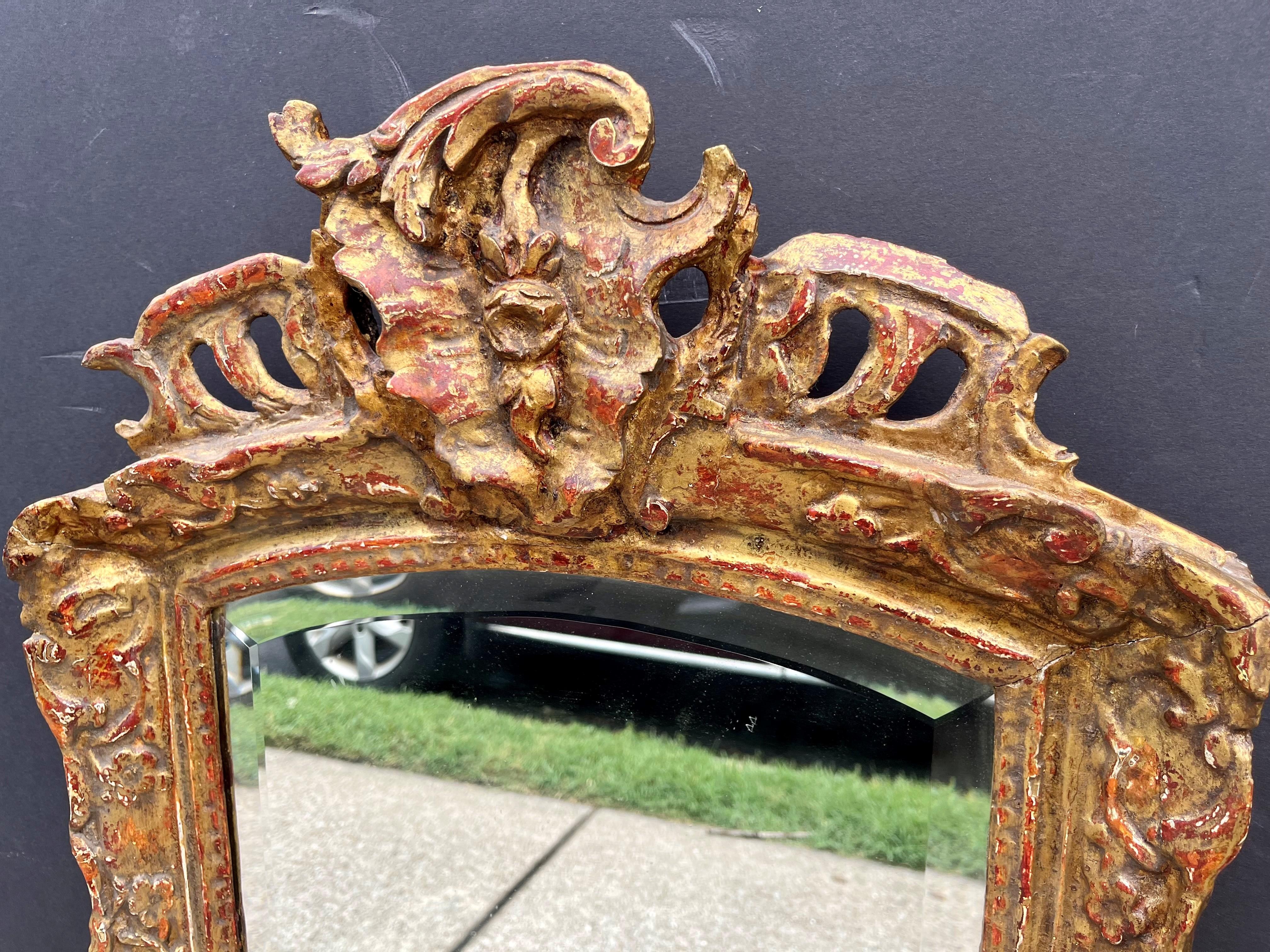 French Regence to Louis XV Transitional Style Giltwood Mirror with Bow Arch For Sale
