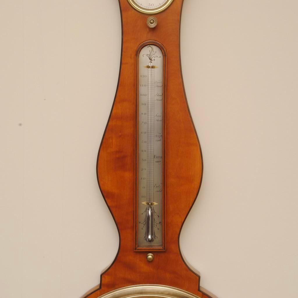 A fine Regency period satinwood 12' wheel barometer in an elegant ebony banded satinwood case by P. Gabalio, London. A similar example can be found illustrated in the N. Goodison book on barometers with the same unusual pediment.