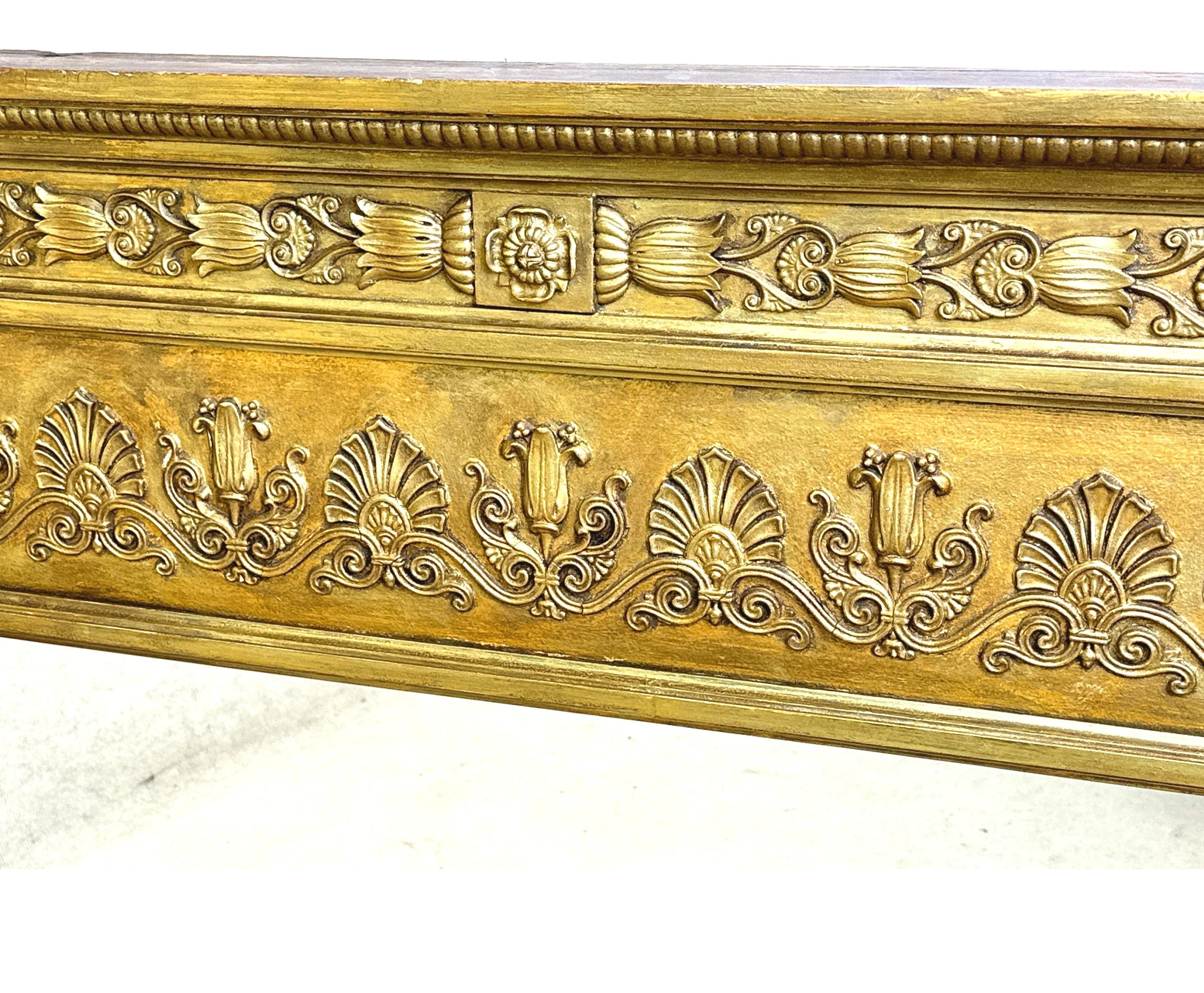 A Very Attractive 19th Century Regency Period Giltwood & Gesso Overmantle Mirror, Having Replacement Triple Mirror Plates, Enclosed By Exceptionally Carved Borders Incorporating S Scrolls, Anthemions, Patrae And Lotus Leaf Decoration.


As the name