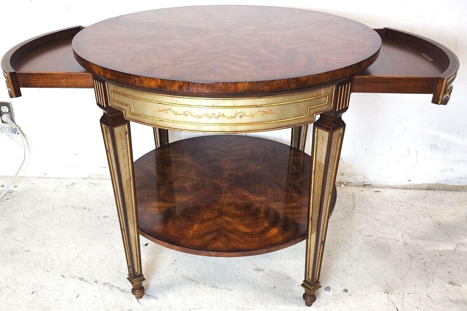 Offering one of our recent palm beach estate fine furniture acquisitions of a
Theodore Alexander regency 2 drawer eglomise occasional side table.
Featuring 2 drawers on either side and flame mahogany top and bottom surfaces.

Approximate