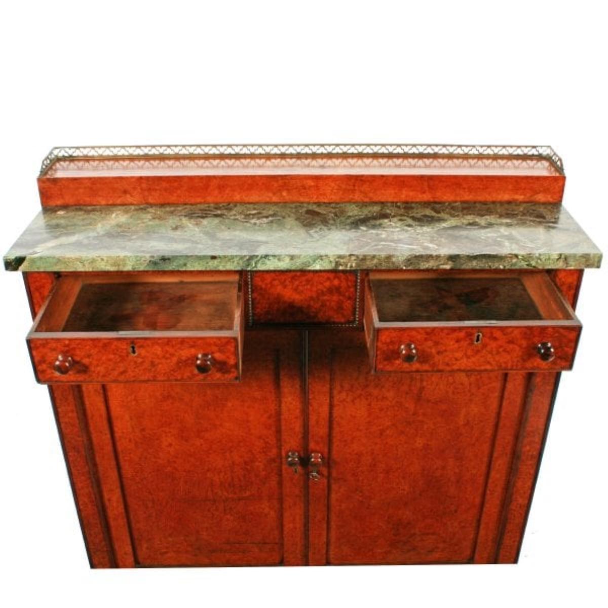 Regency Amboyna & Rosewood side cabinet

An unusual amboyna veneered Regency marble top side cabinet.

The cabinet has rosewood mouldings throughout and mahogany linings to the drawers.

The pair of cabinet doors have recessed panels and