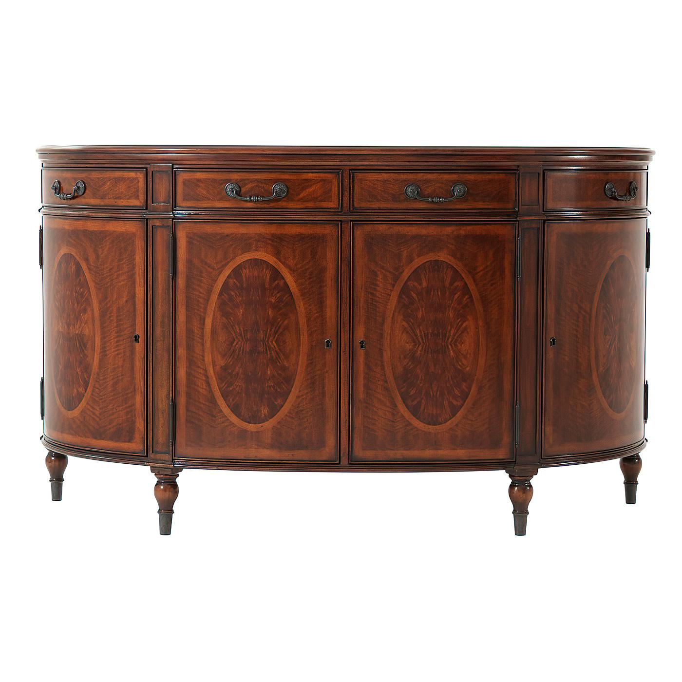 A French Empire style bowfront flame okum veneered and oval pollard oak burl panel inlaid side cabinet or buffet, the brass bound top above three frieze drawers above four cabinet doors enclosing three adjustable shelves, flanked by brass mounted
