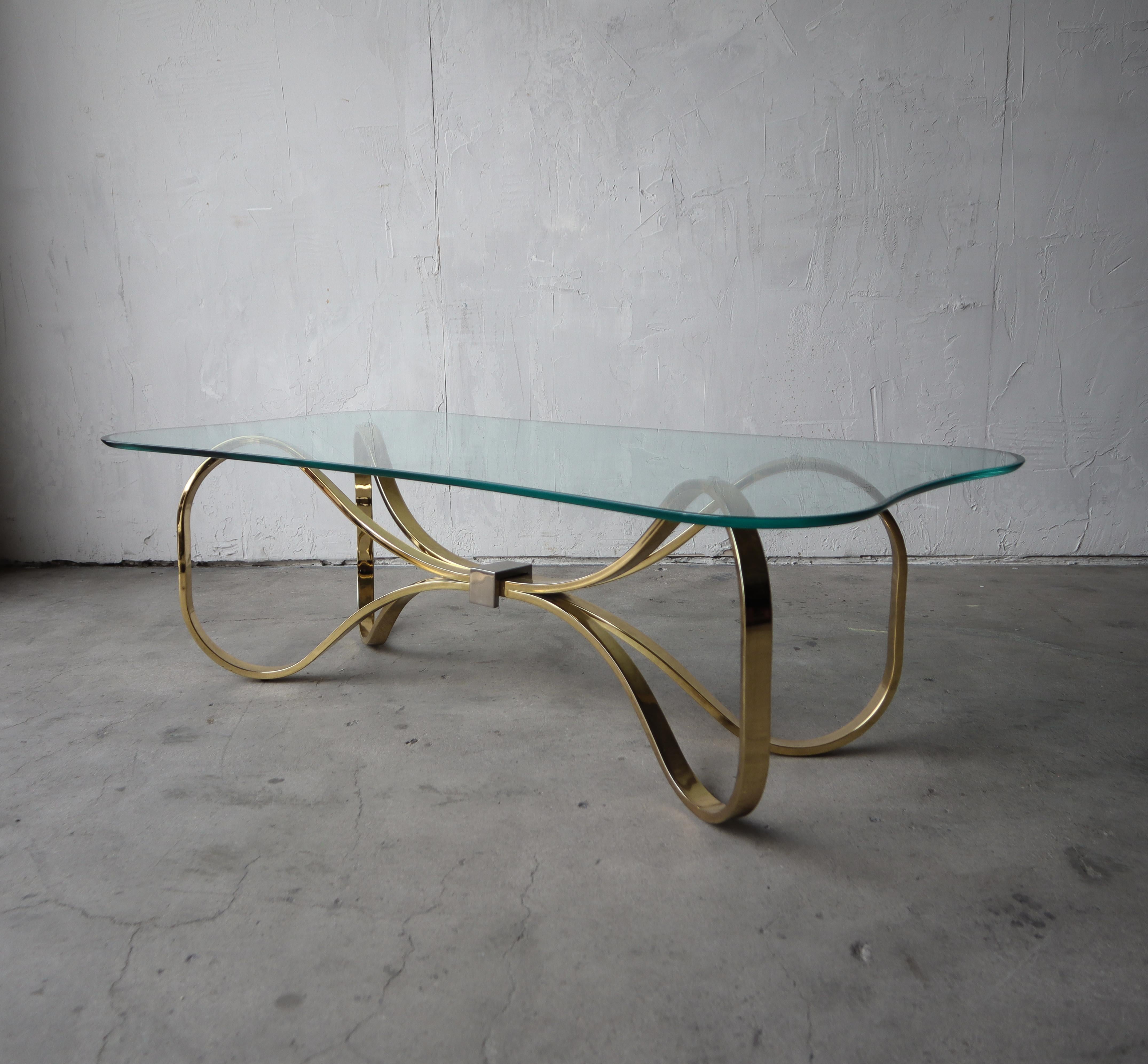 Hollywood Regency Regency Brass and Glass Bow Tie Coffee Table For Sale
