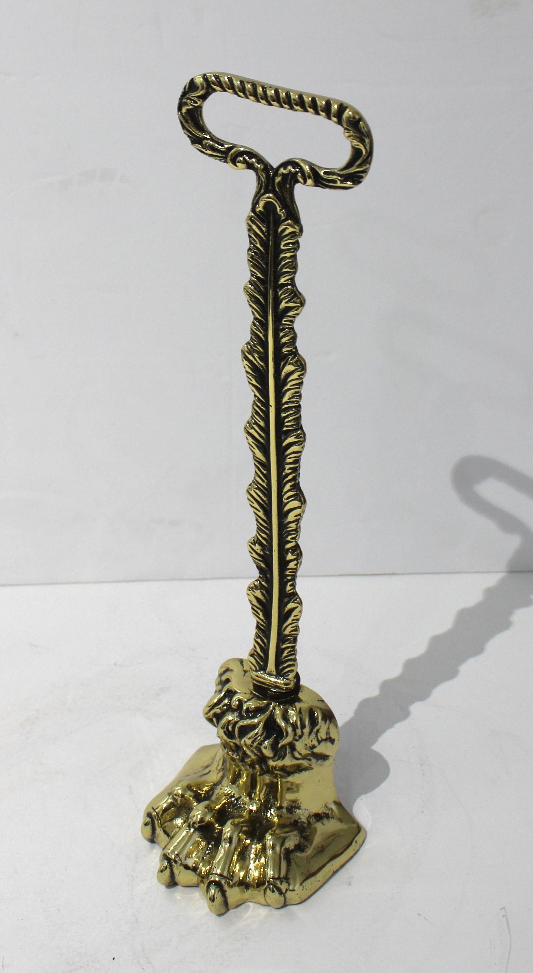 Antique Regency brass doorstop lion 's paw motif from a Palm Beach estate. Weighted with lead. Professionally polished and lacquered.