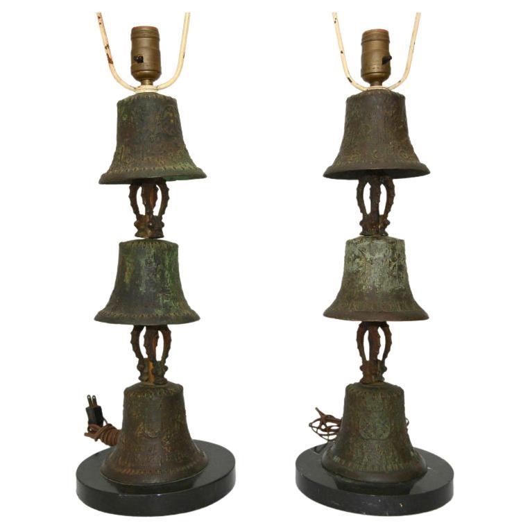 
Guadalajara Regency patinated bronze Mejico bell table lamps mounted on black marble base Mexico
Each lamp is made of three bronze bells decorative relief.
21 tall base of socket x 7 in diameter at widest point.
Retains beautiful vintage patina.