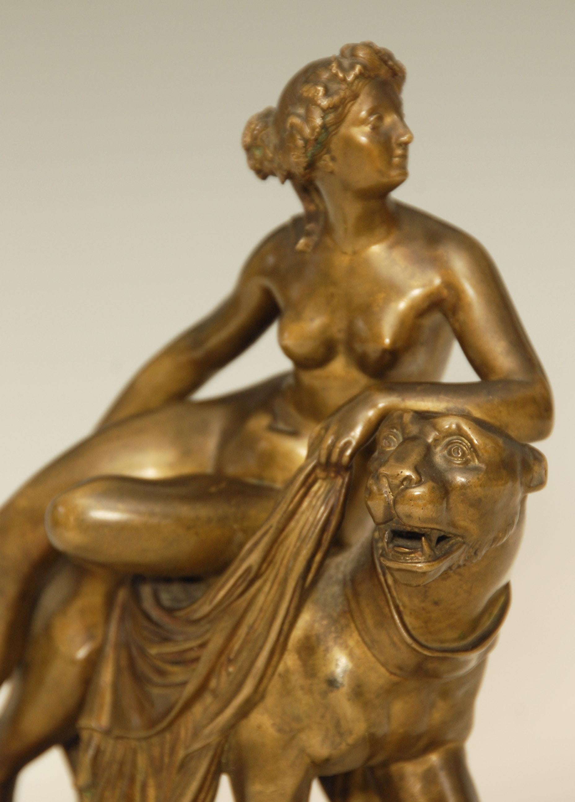 A very stylish 19th century bronze of a naked female riding on a lion mounted on a sienna and white marble base.

Price includes free shipping to anywhere in the world.