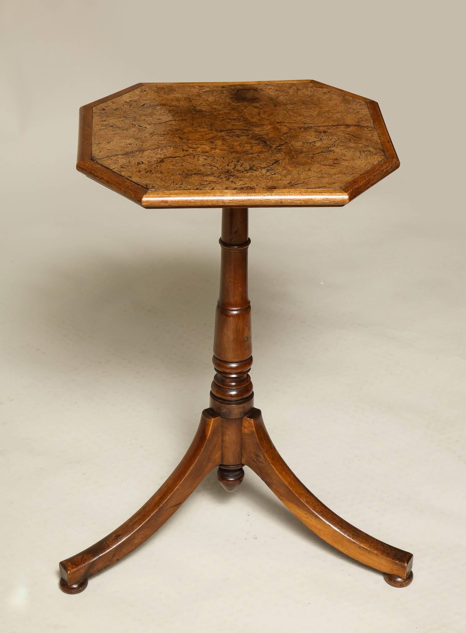 Fine Regency octagonal tripod table, highly figured burl oak top having rich yew wood molded edge, standing on a turned yew shaft with drop finial, the down-swept legs standing on flattened ball feet, the whole with good, mellow color.