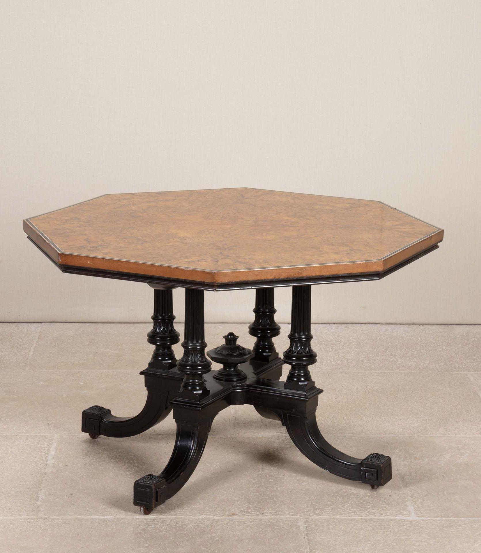 Regency burr oak octagonal low table.
With segmented burr oak top with an ebony band around the top edge. Raised on an ornate ebony base consisting of four decoratively carved columns onto a X stretcher again raised on four kick curved square legs.