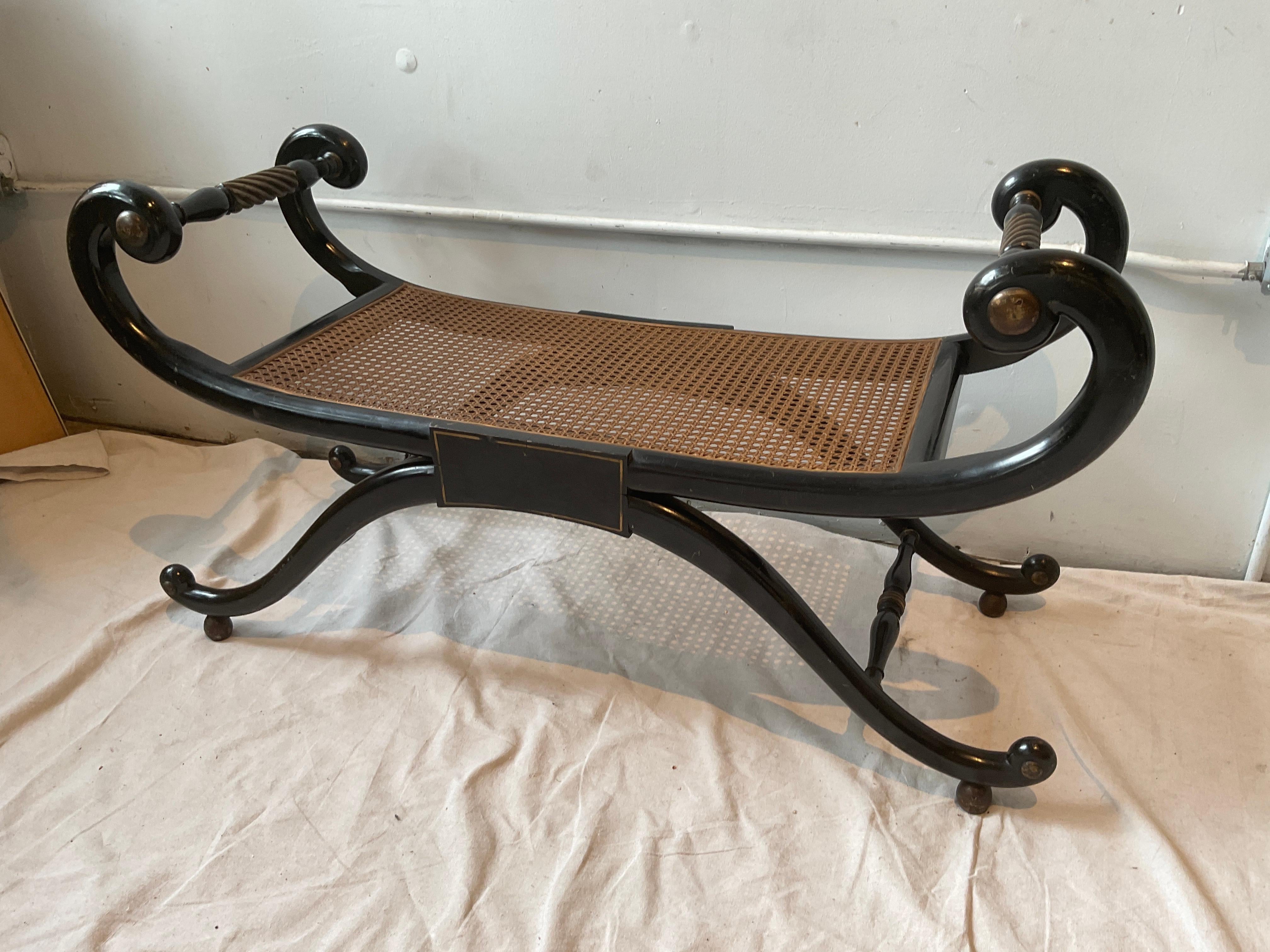 1950s Regency style  caned bench.
Knicks in finish.