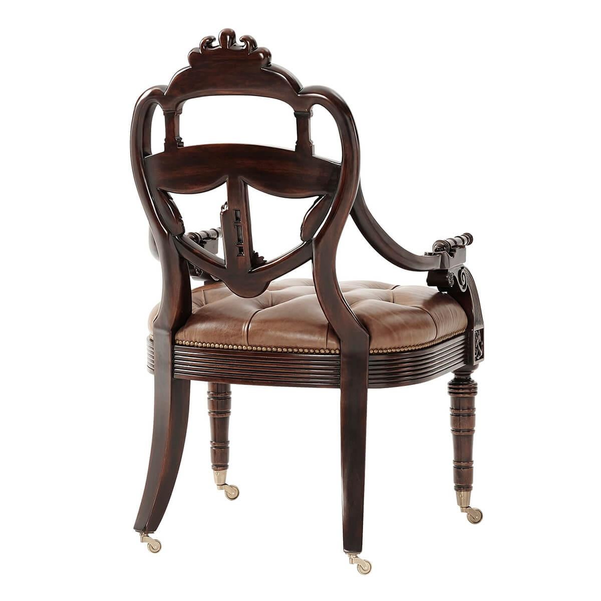 An exceptionally well hand carved mahogany library armchair, the back in the shape of a ship's transom carved with a coat of arms centered by the spencer crest and flanked by Victory wreaths. Inspired by a Regency original.

Dimensions: 44.25” H x