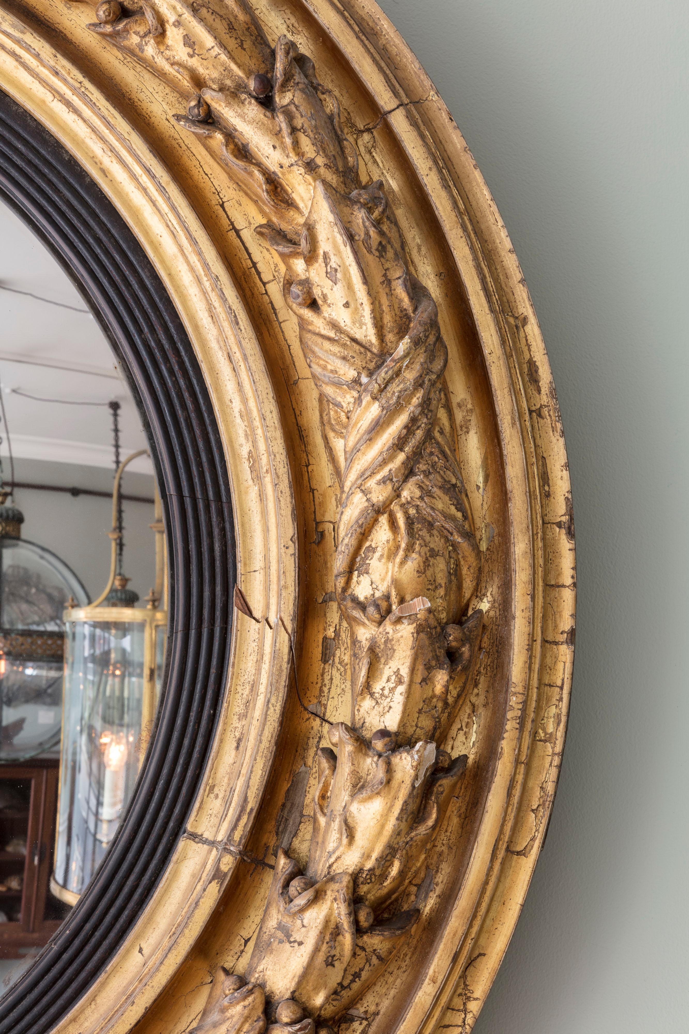 A Regency Carved Giltwood Convex Mirror

Additional information:
Dimension: Diameter: 92 cm, 36 1/4″
Depth: 10 cm, 4″