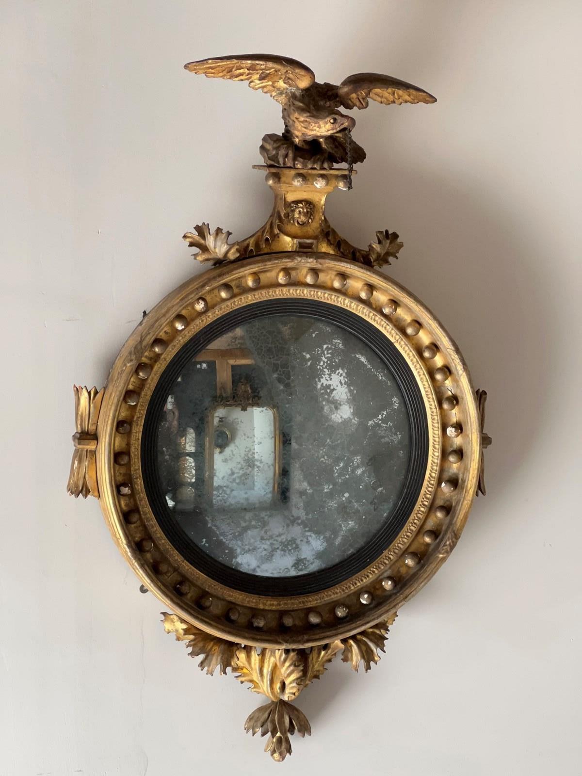 Hand-Carved Regency Carved Giltwood Convex Wall Mirror For Sale