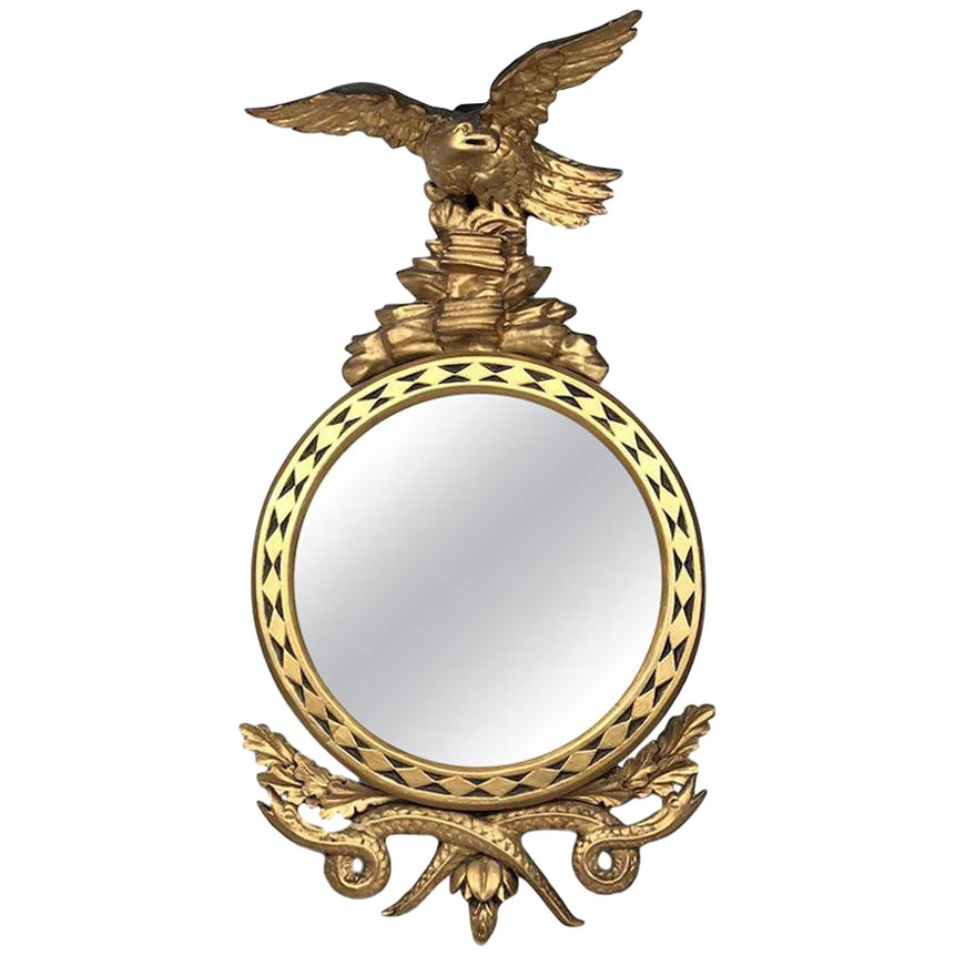 Miroir aigle-serpent en bois doré sculpté de style Régence