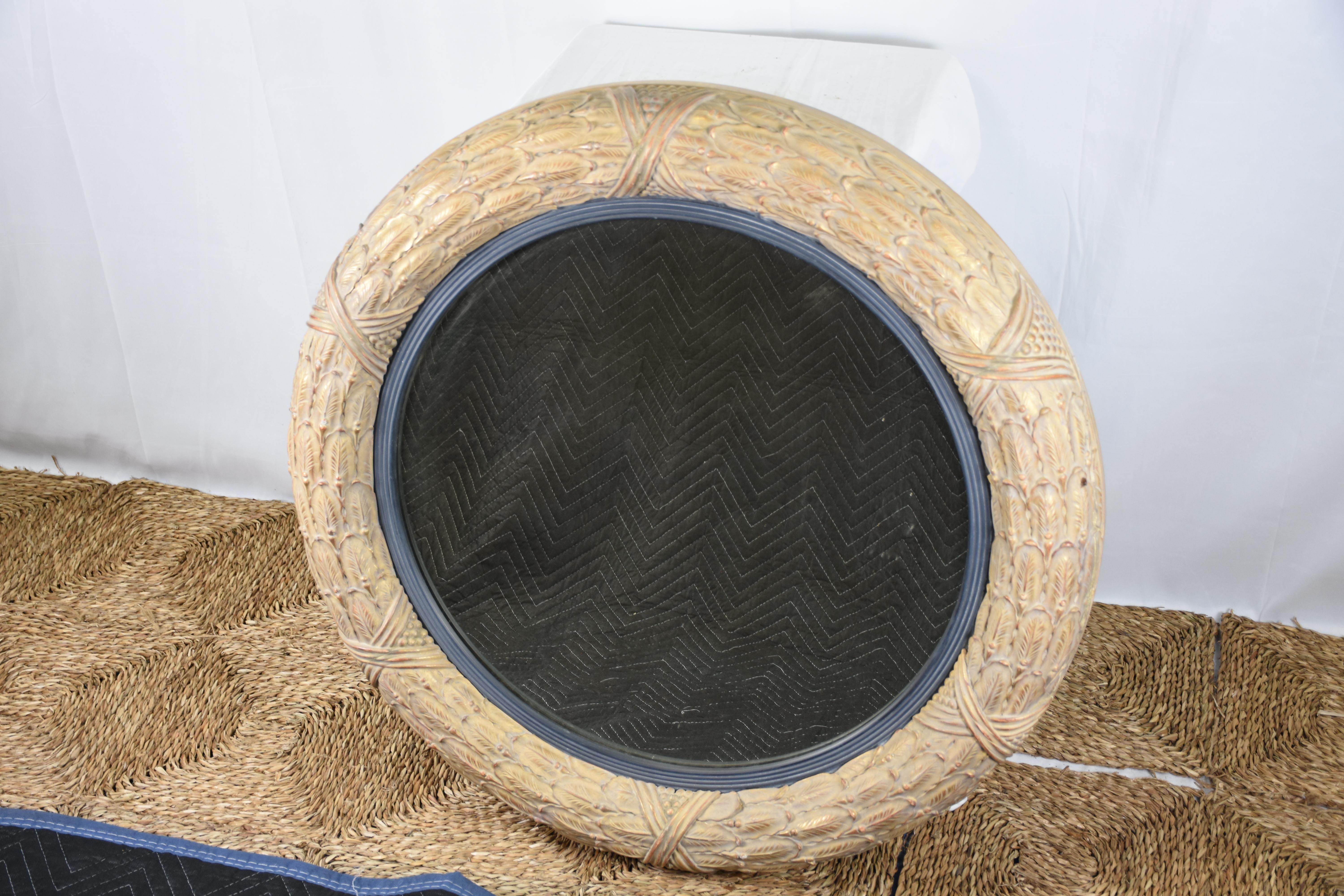 An elegant Regency style carved giltwood mirror, reproduction based on original 19th century designs. This finely crafted example embodies the sophistication and grandeur of the English Regency period, characterized by its refined neoclassical