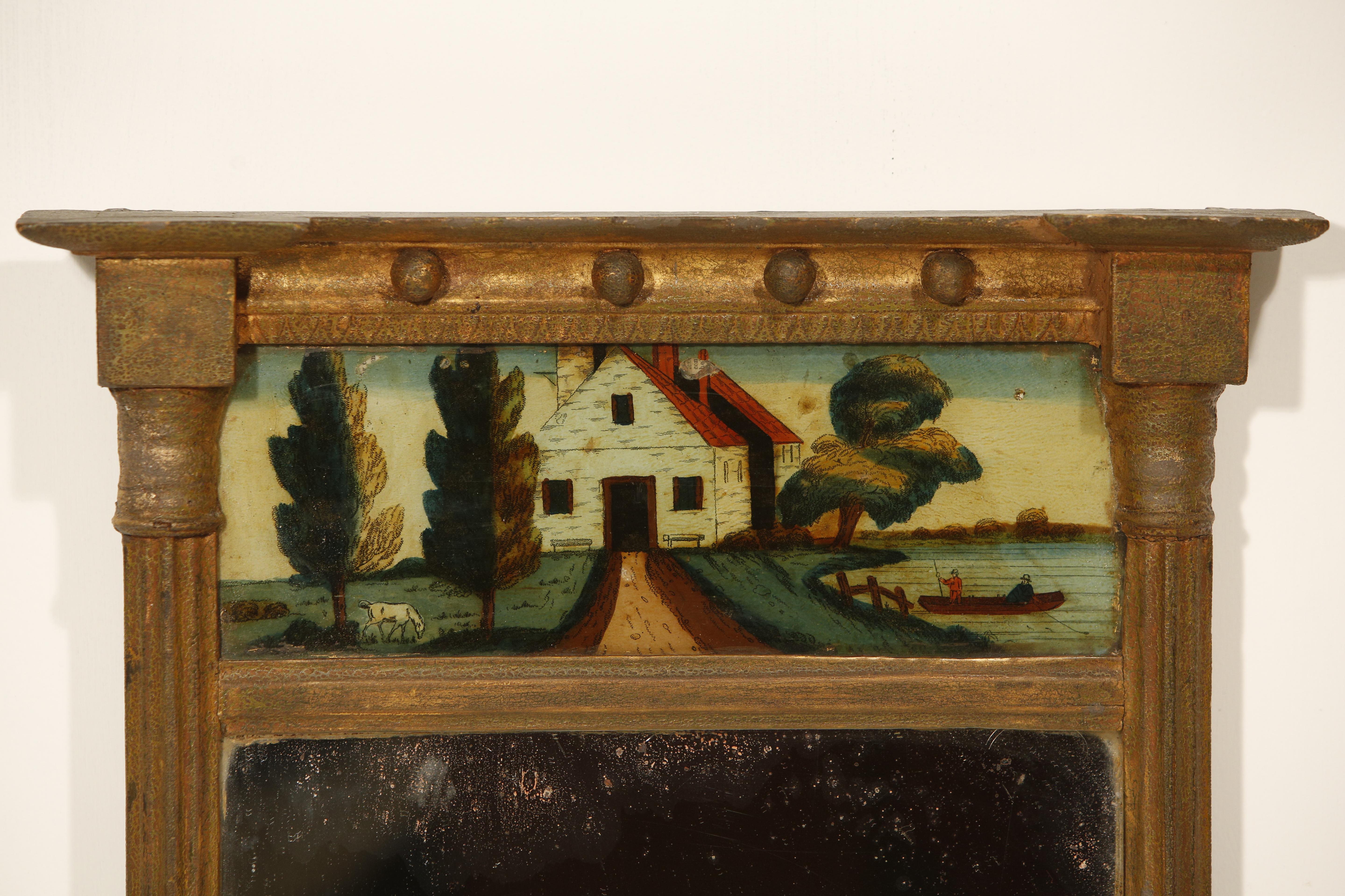Miroir de style Régence en bois sculpté et doré Panneau en églomisé Trumeau 

Miroir de style Régence en bois sculpté et doré avec panneau en églomisé.

Le cadre est en bois doré sculpté et en gesso, orné d'un fronton et de quatre boules pendantes