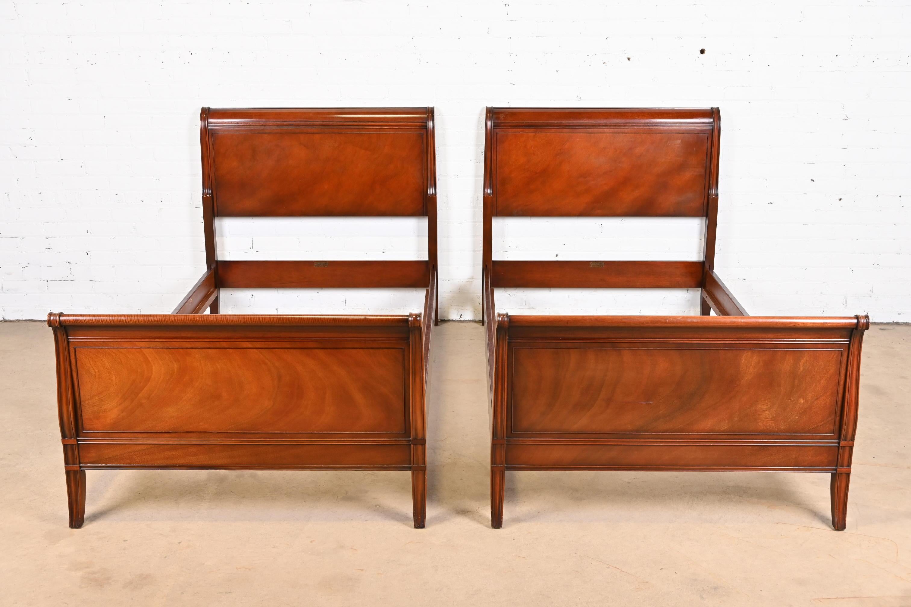 A gorgeous pair of Regency or Empire style carved mahogany twin Size sleigh beds

By Fallon & Hellen

USA, circa 1930s

Each measures: 40.75