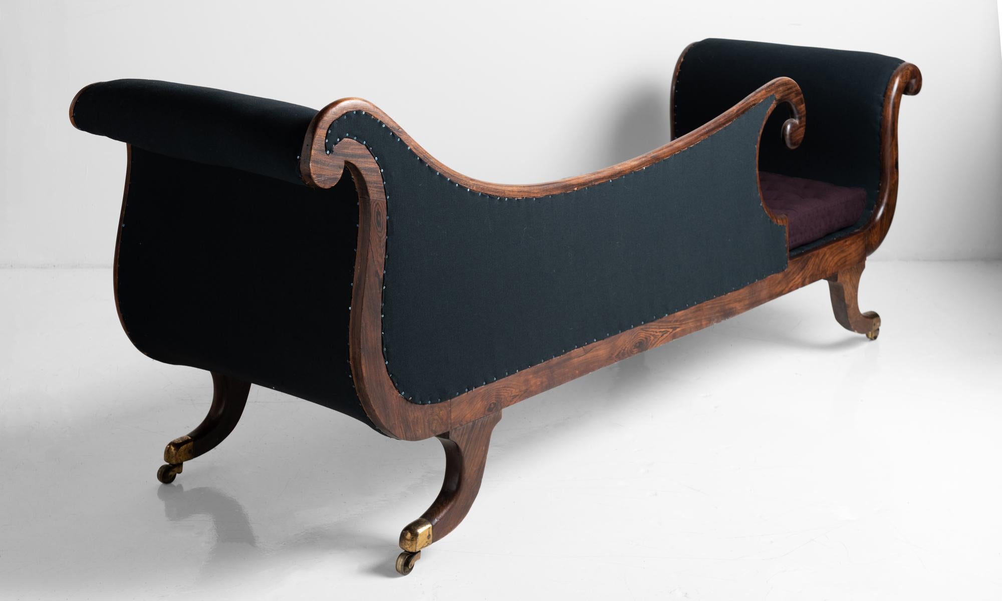 Beautifully carved chaise with brass inlay and original brass castors. Newly upholstered in Maharam fabric. 



Measures: 84