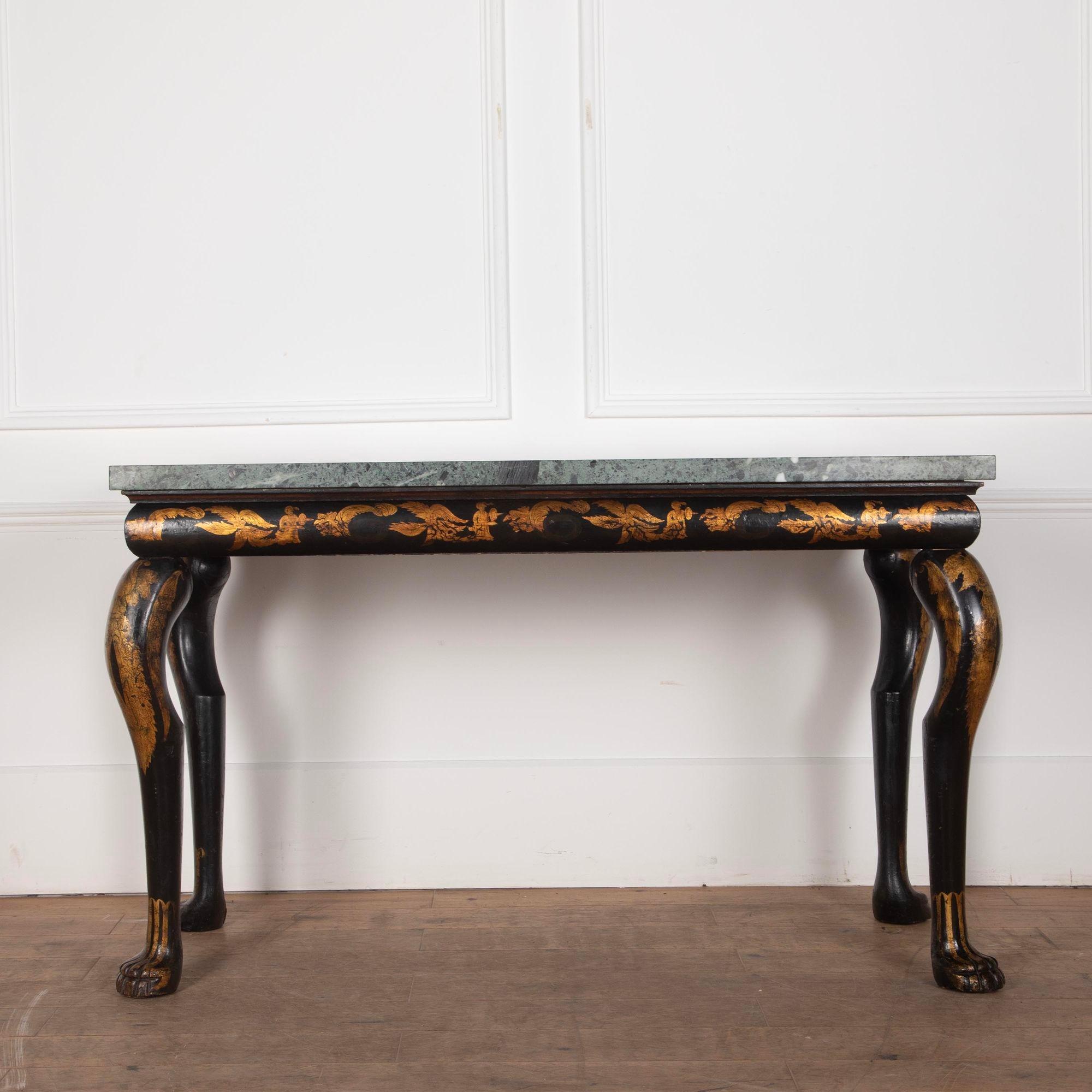Early 19th Century English black and gilt chinoiserie marble top side or console table.The Greek green marble top, later replaced, sits above a cushion frame frieze with exaggerated cabriole legs and stylised paw feet. The whole with chinoiserie