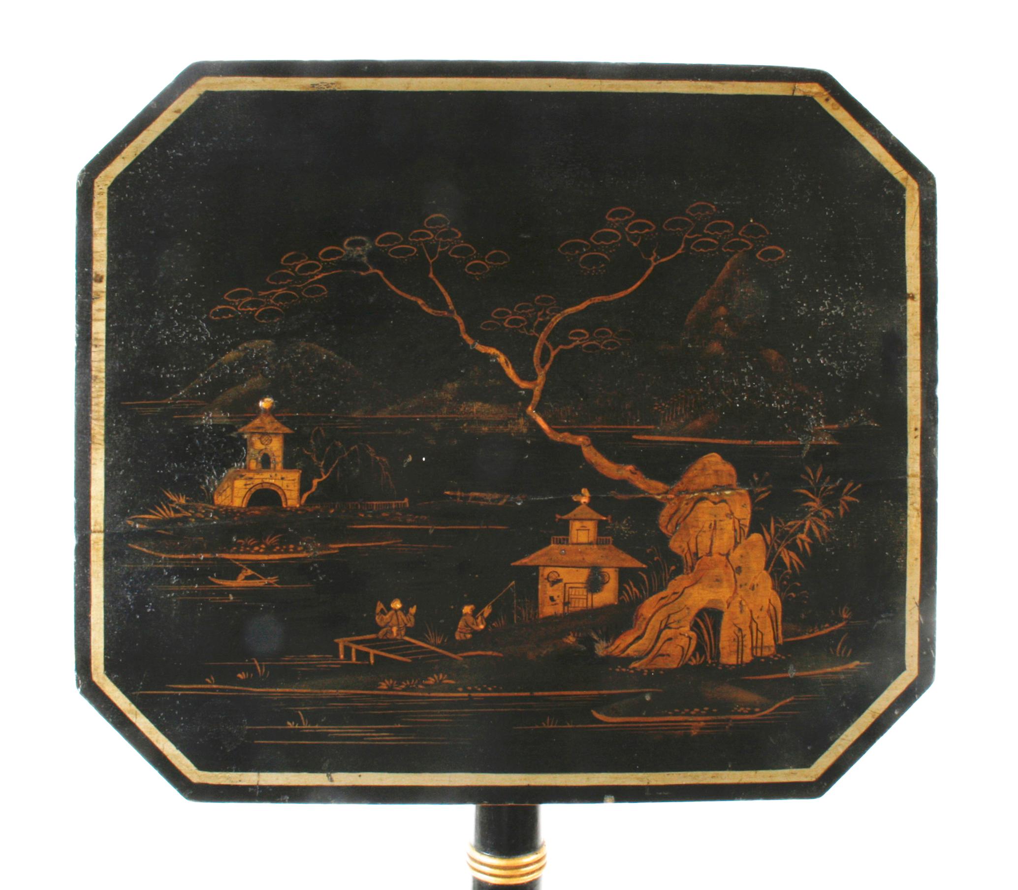 Regency Chinoiserie and parcel-gilt decorated telescoping tilt-top table. The gilt banded tabletop is decorated with an Asian country lake scene with pagodas and fishermen. The turned pedestal is also gilt decorated with cabriolet tripod legs ending