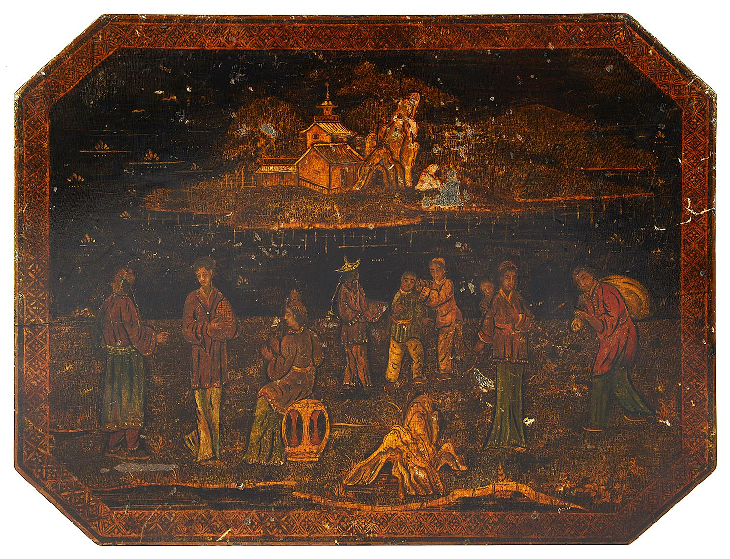 A good quality Regency period Chinoserie lacquer lamp table, having an oriental scene painted on the top of people and children playing by the lake side. Raised on a Coromandel tripod base, terminating in the original brass castors.