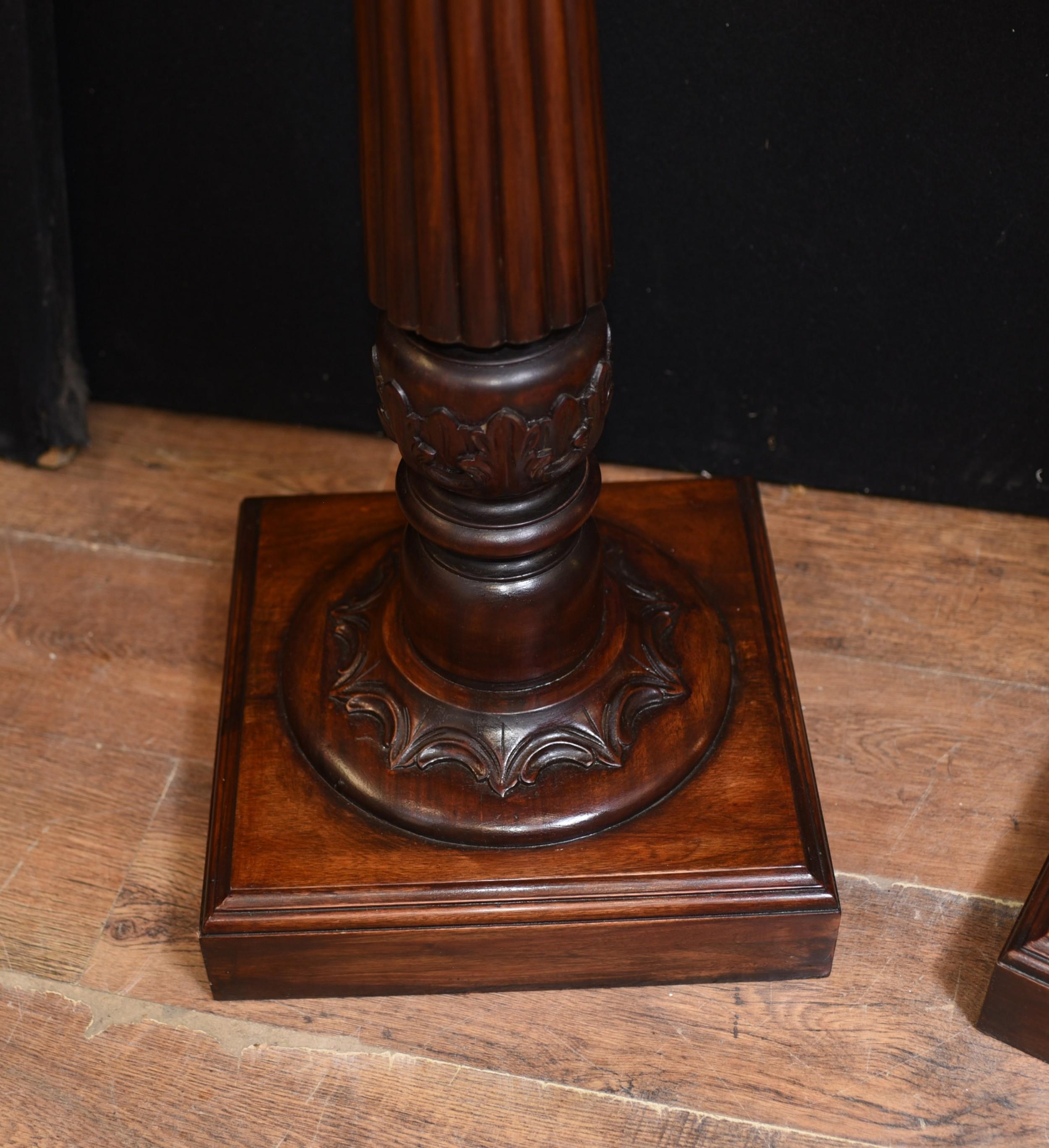 - Gorgeous pair of Regency style mahogany pedestal stands
- Classical columns perfect for displaying busts, vases or other decorative pieces
- Hand carved details very ornate and florid
- Vases shown are available but not included in the
