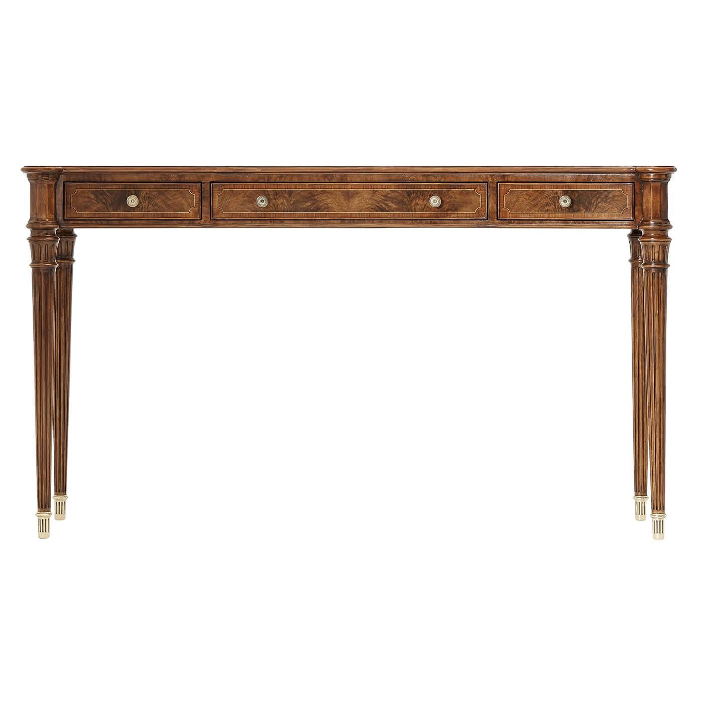 A fine Regency style flame walnut and yew burl veneered console table, the yew burl crossbanded top with a concave front and sides, with protruding rounded corners above three line strung frieze drawers, on turned and fluted tapering legs