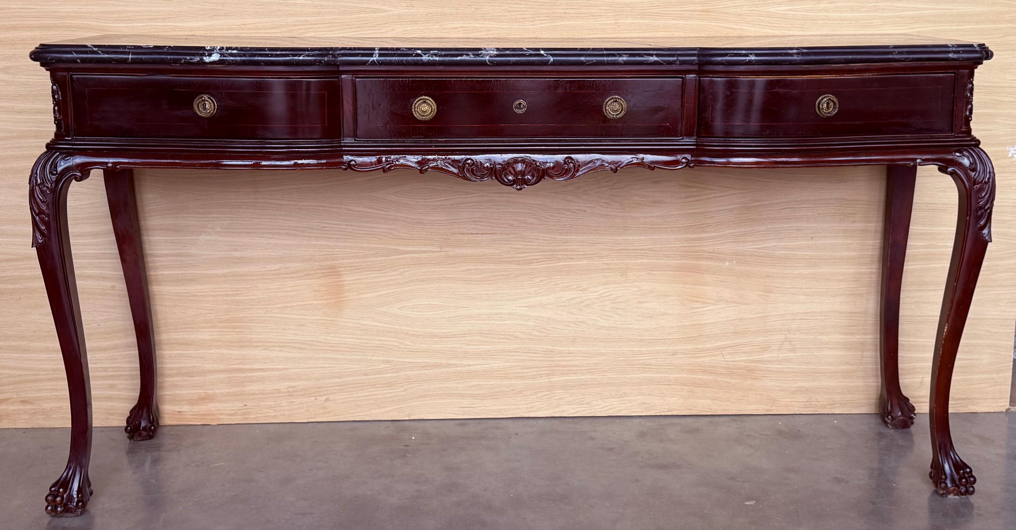 Espagnol Table console Regency avec trois tiroirs et marbre noir en vente