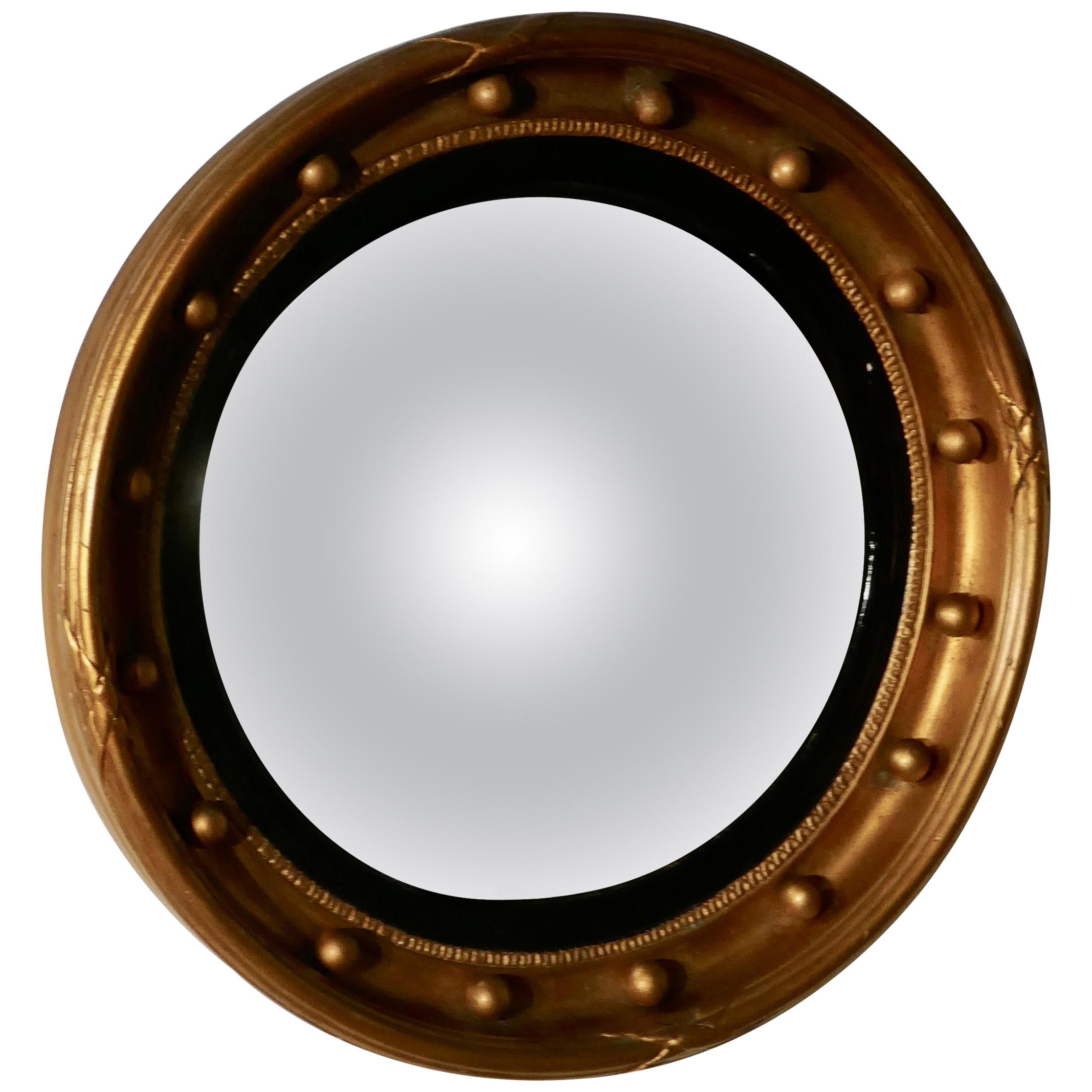 Regency convex gilt wall mirror


This stunning mirror has a deep gilt frame decorated with spheres, the convex glass is held with a reeded ebony mount

The large 3” round frame is in sound condition as is the original convex looking glass
The