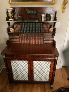 Regency credenza cabinet with open shelves and brass grill doors