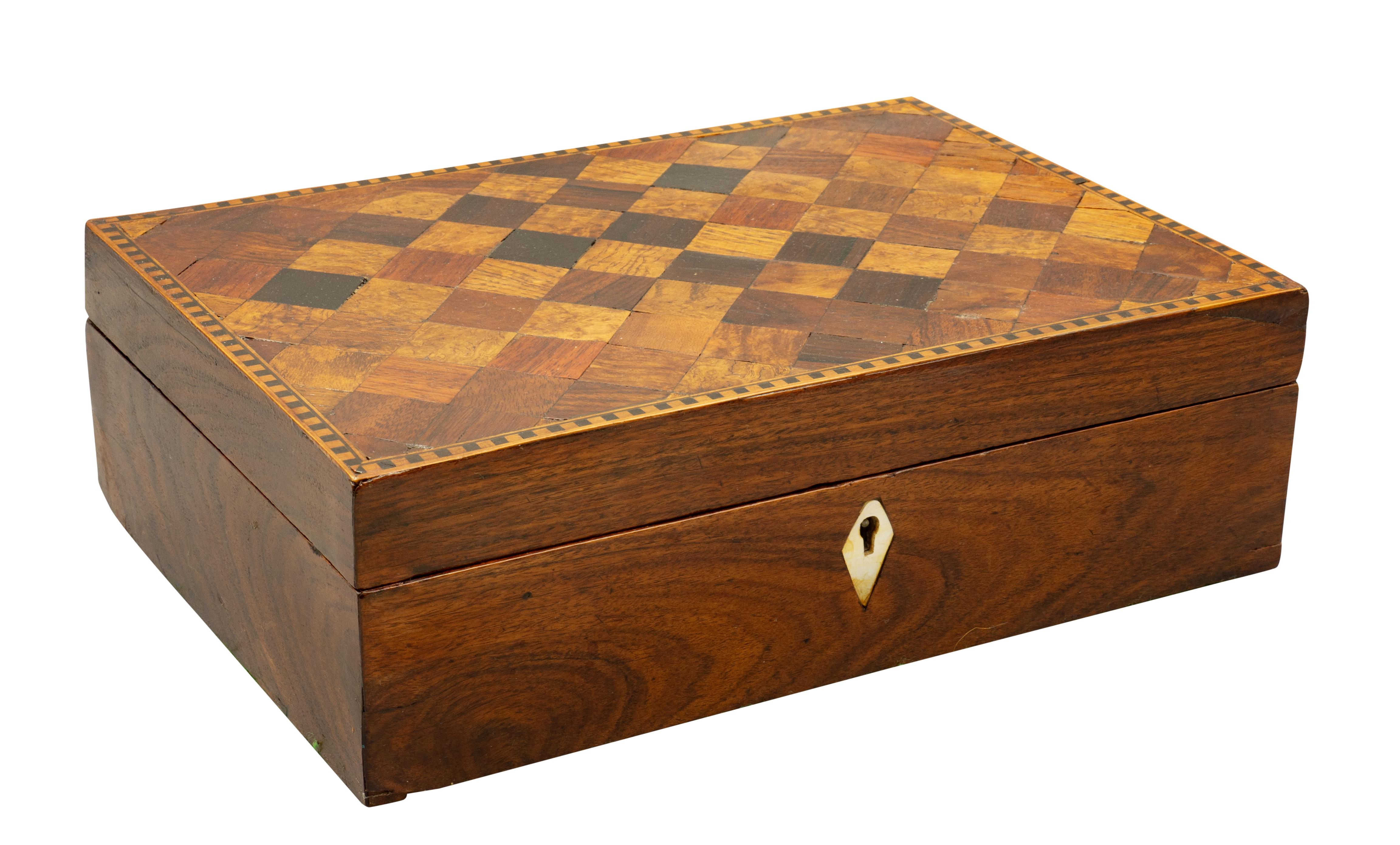 Rectangular hinged lid with cube inlays and conforming case. With key. Mother of pearl escutcheon.