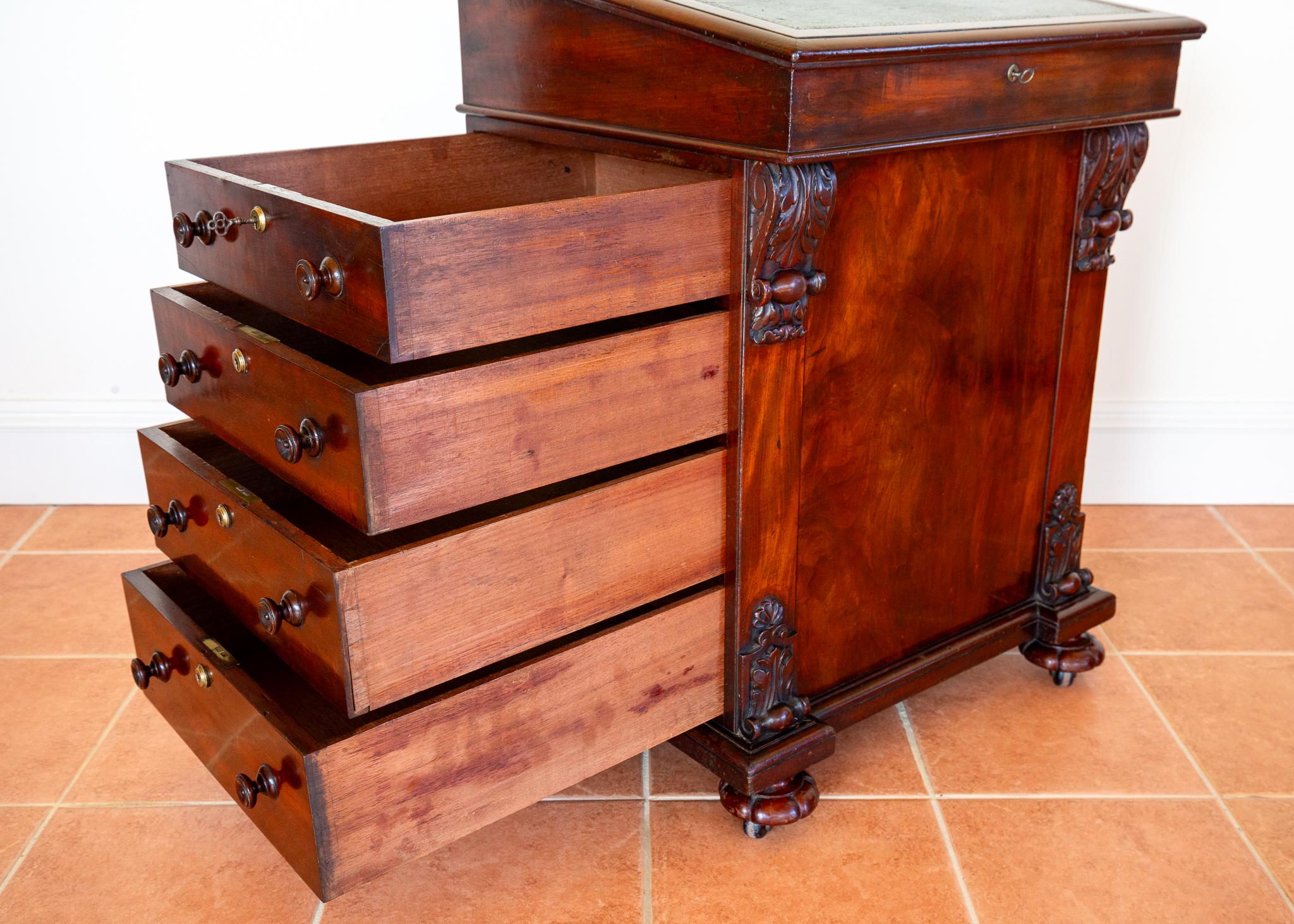 A beautiful, special and very rare flame mahogany Georgian Davenport in wonderful condition. Made by heralded furniture makers Freemans of Norwich, most likely in the 1830s, this fabulous and very much still highly usable Davenport will add superb