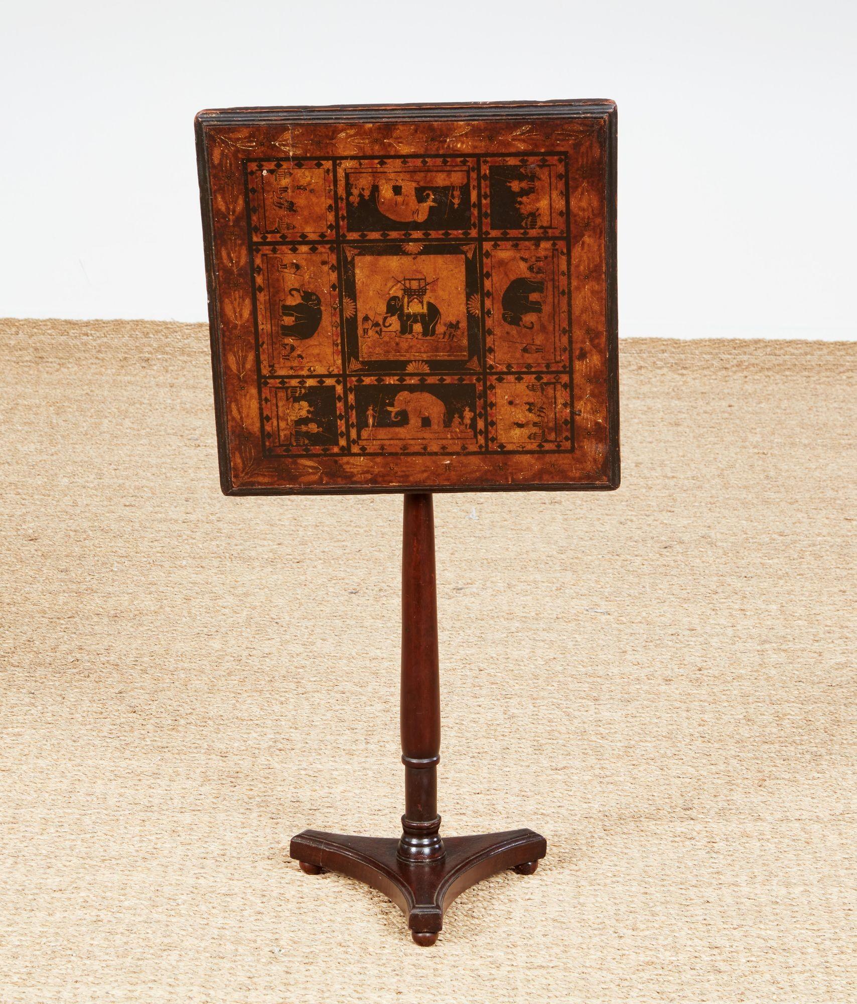 Quirky Regency tilt top occasional table, the top decorated with decoupage and penwork panels depicting elephants and Raj palaces, either Indian made for the English market, or domestically made catering to the Imperial tastes of the time.