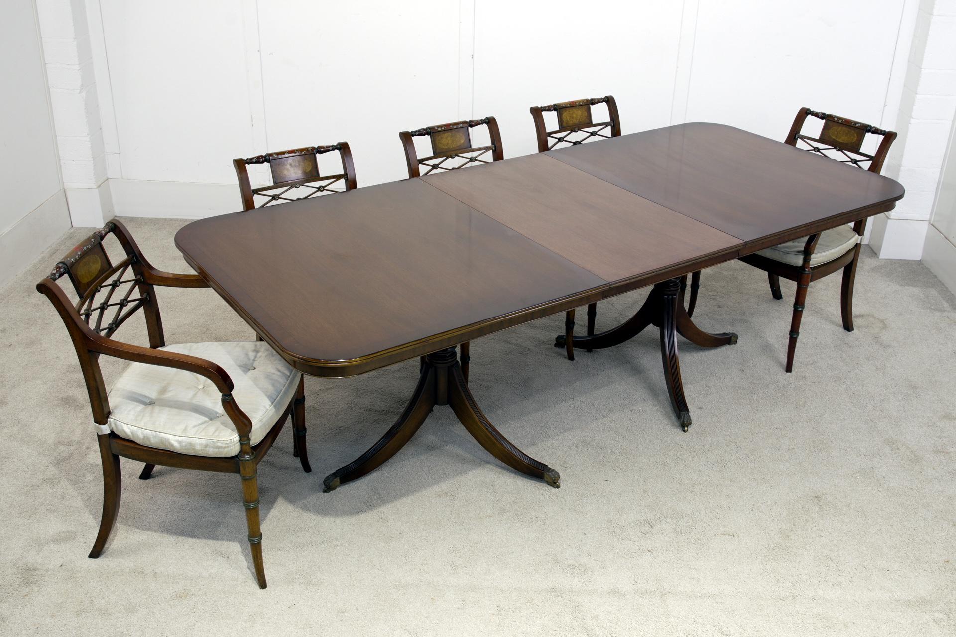 You are viewing a gorgeous Regency Revival dining set with 8 chairs
Classic mahogany extending pedestal table that seats 8 people comfortably The chairs consist of two arm chairs and six side chairs
Circa 1920
Comes with one extension leaf
Chairs