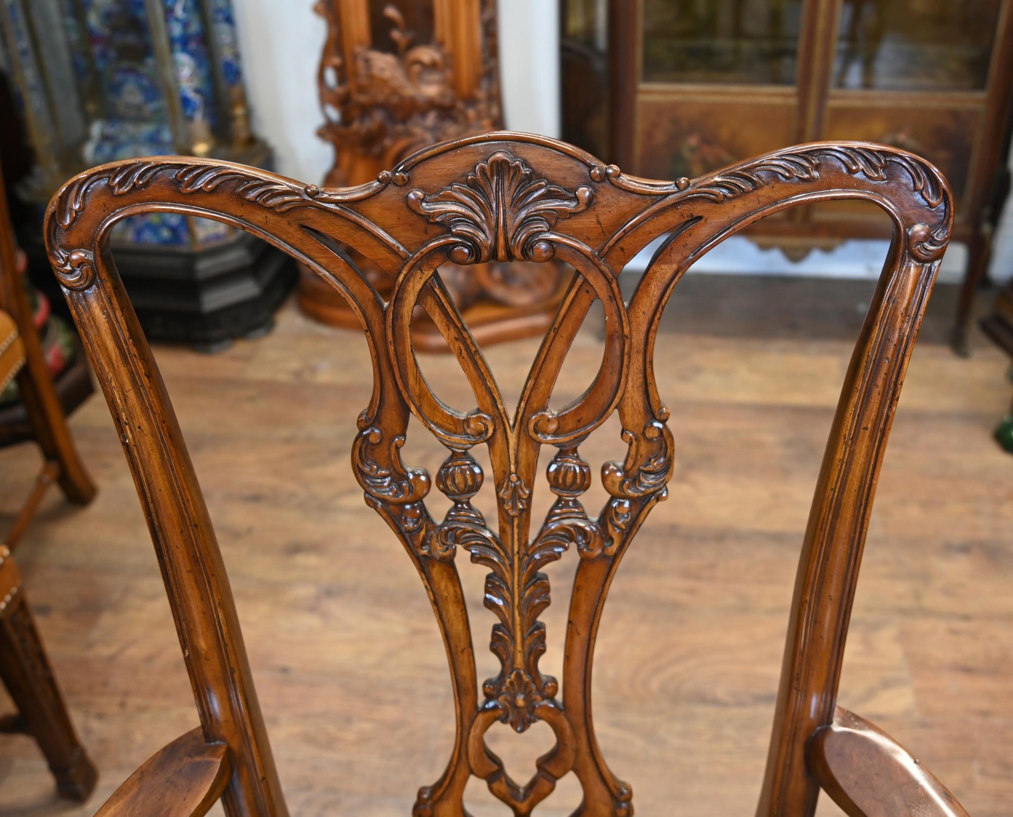 Sumptuous Regency style walnut pedestal dining table and set of matching Chippendale chairs
The set of ten chairs consists of two arm chairs and eight side chairs
Table works on a leaf system so you can use it at various different sizes with or