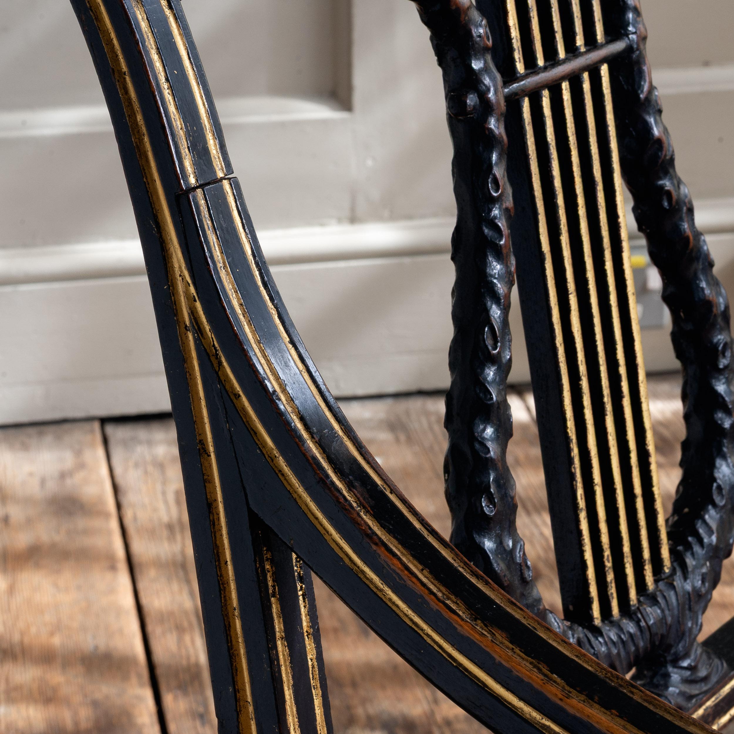 Regency-Sessel, ebonisiert und paketvergoldet (Britisch) im Angebot