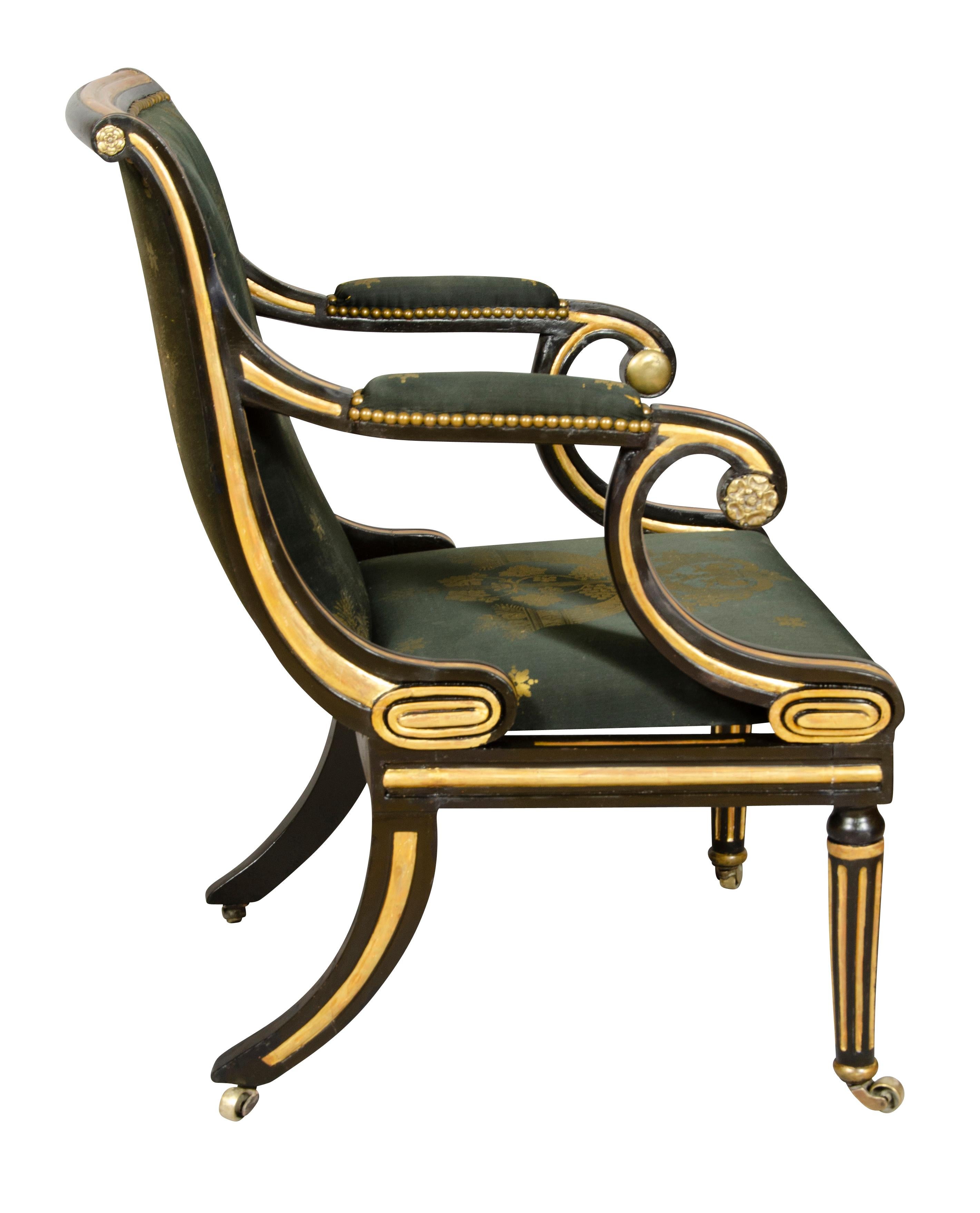 With a scrolled crestrail and upholstered back and seat, scrolled arms and circular tapered legs with fluting. Casters.