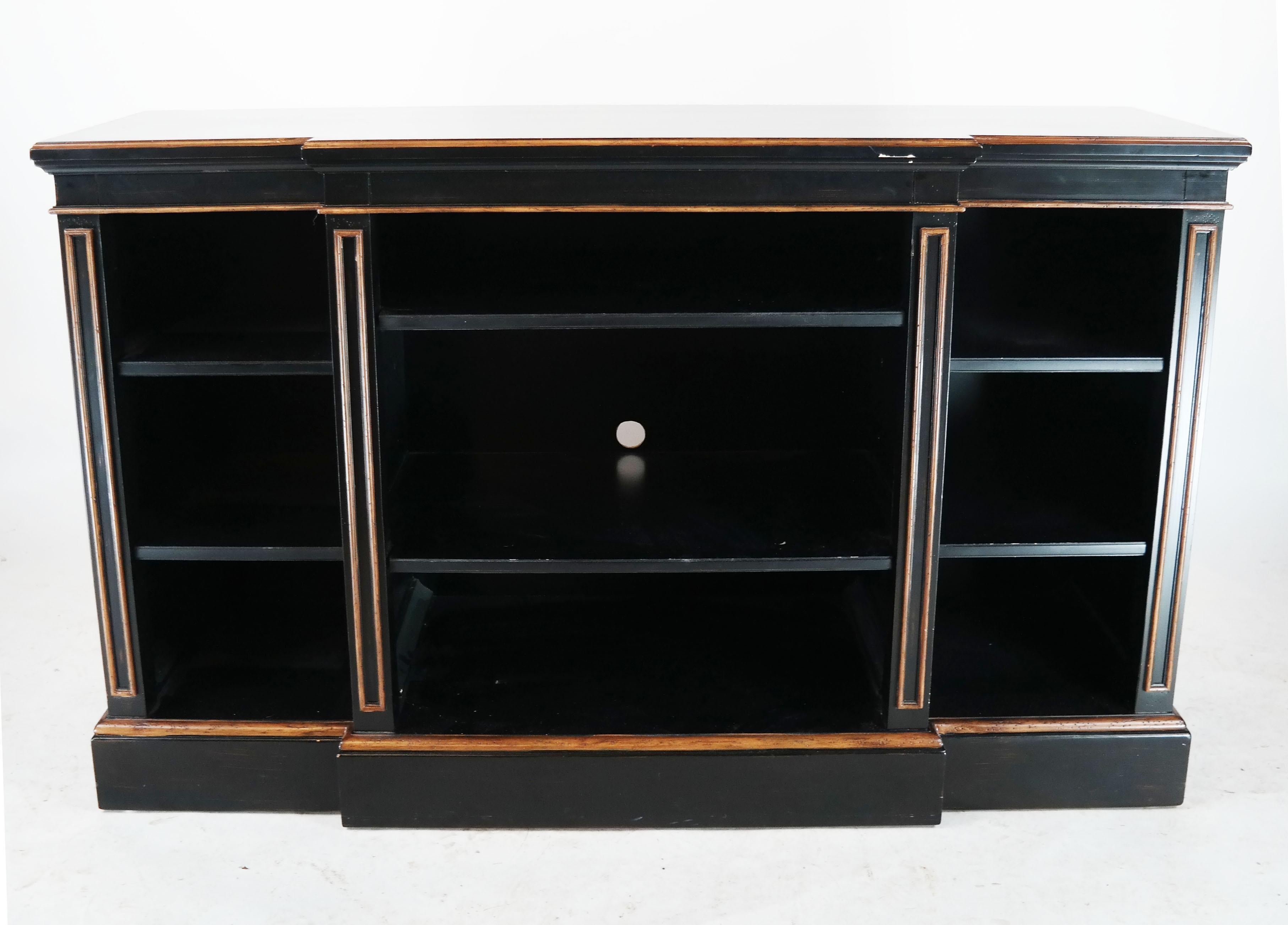 Regency ebonized bookcase with gilt detail. Three sections with two adjustable shelves. Great as a media cabinet.