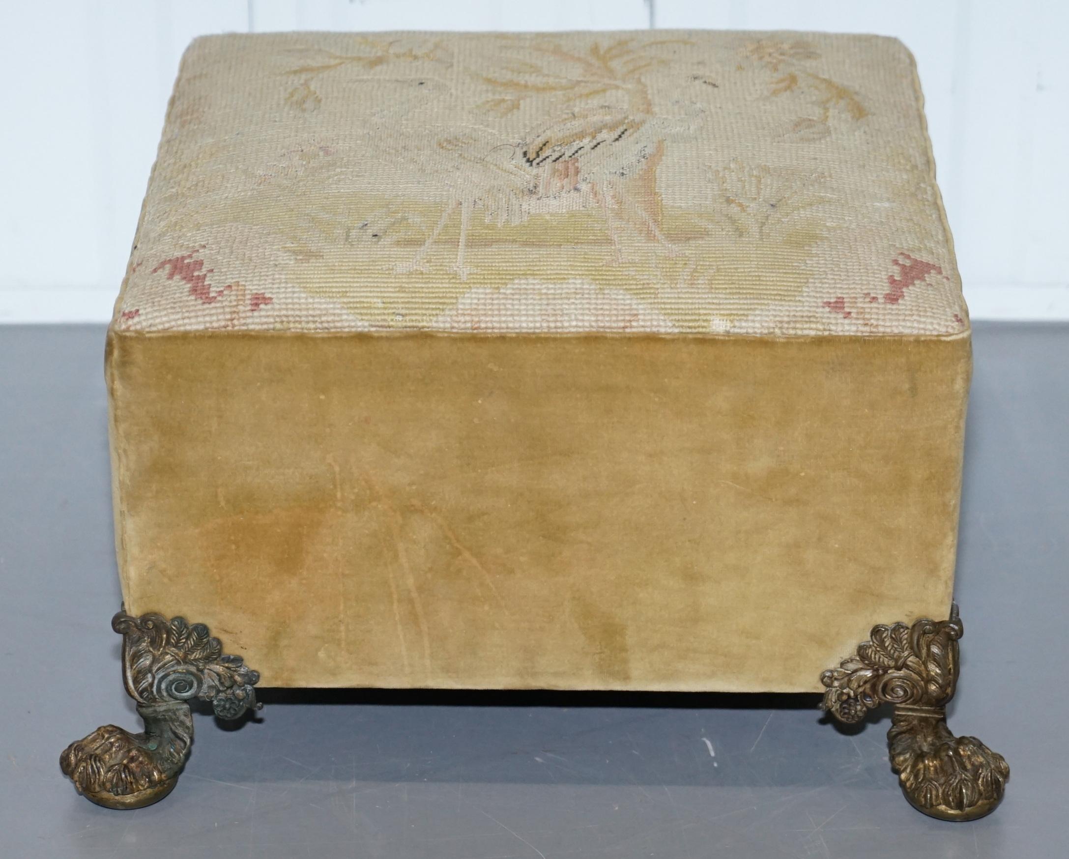 We are delighted to offer for sale this stunning hand embroidered Regency footstool with ornate bronze hairy paw feet from the Ian Thomas estate, dressmaker to Lady Diana

A very good looking and well made piece, the embroidery is stunning, it