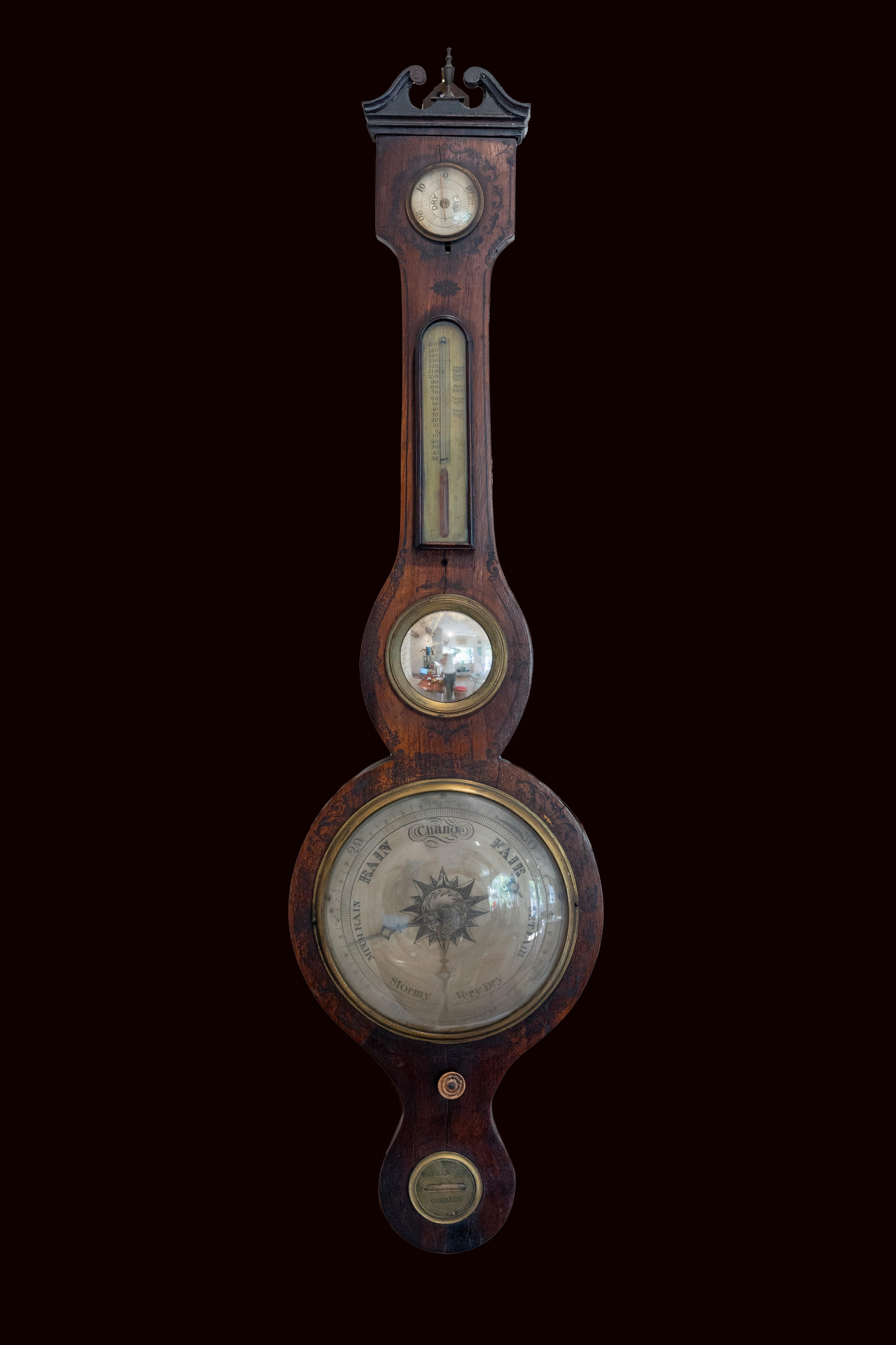 18th century antique black painted rosewood banjo barometer having a swan neck pediment with a quality shaped figured Rosewood case. It boasts a silvered engraved dial with original hands, thermometer, fitted hygrometer and original bone setting