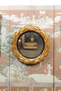 Regency English Giltwood and Ebonized Convex Laurel Leaf Bulls Eye Mirror