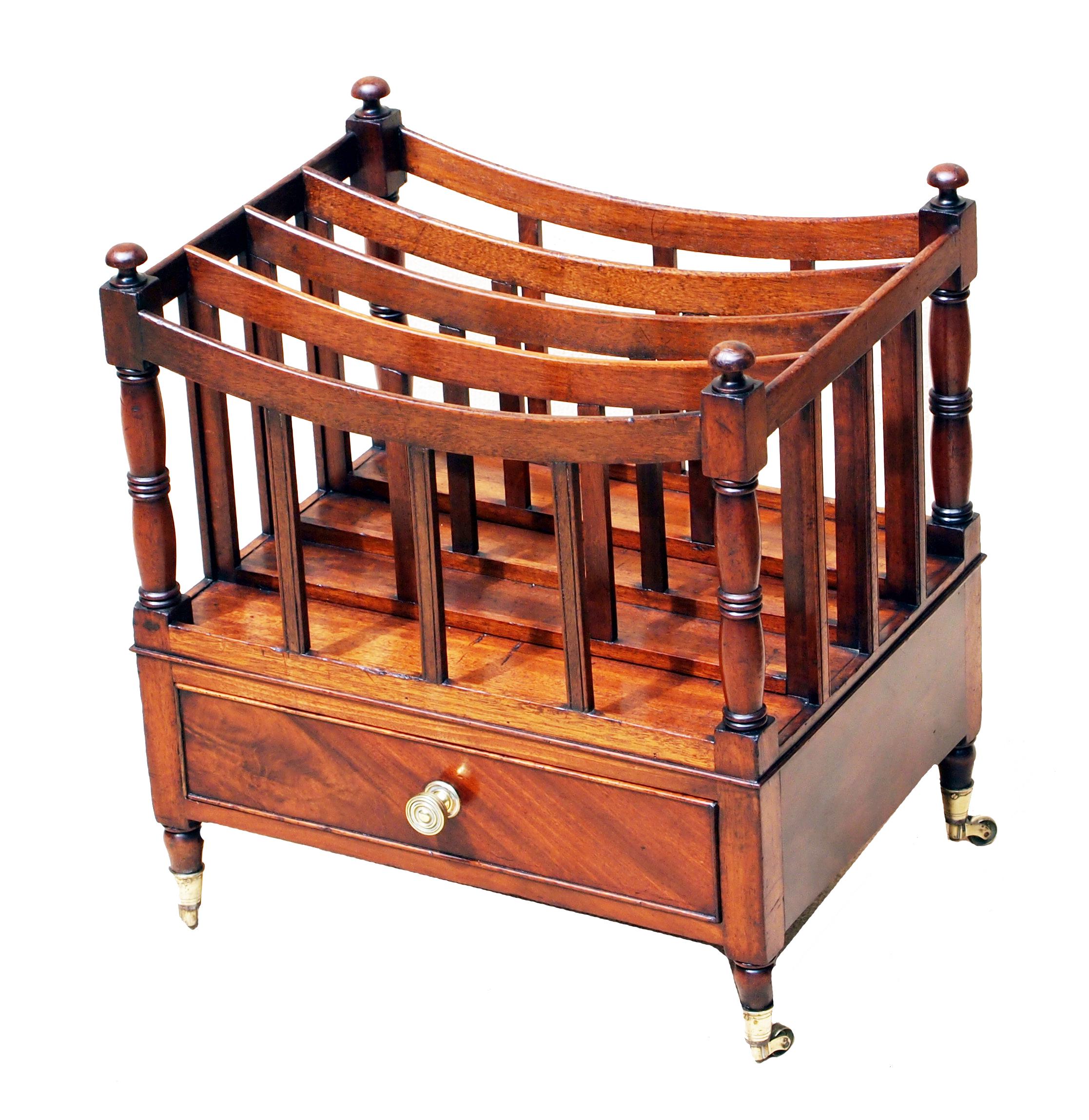 A Good Quality Regency Mahogany Boat Shaped
Canterbury Having Elegant Turned Upright Supports
And One Well Figured Frieze Drawer Raised On 
Elegant Turned Legs

(The name Canterbury is believed to have originated
for these articles when the Duke of