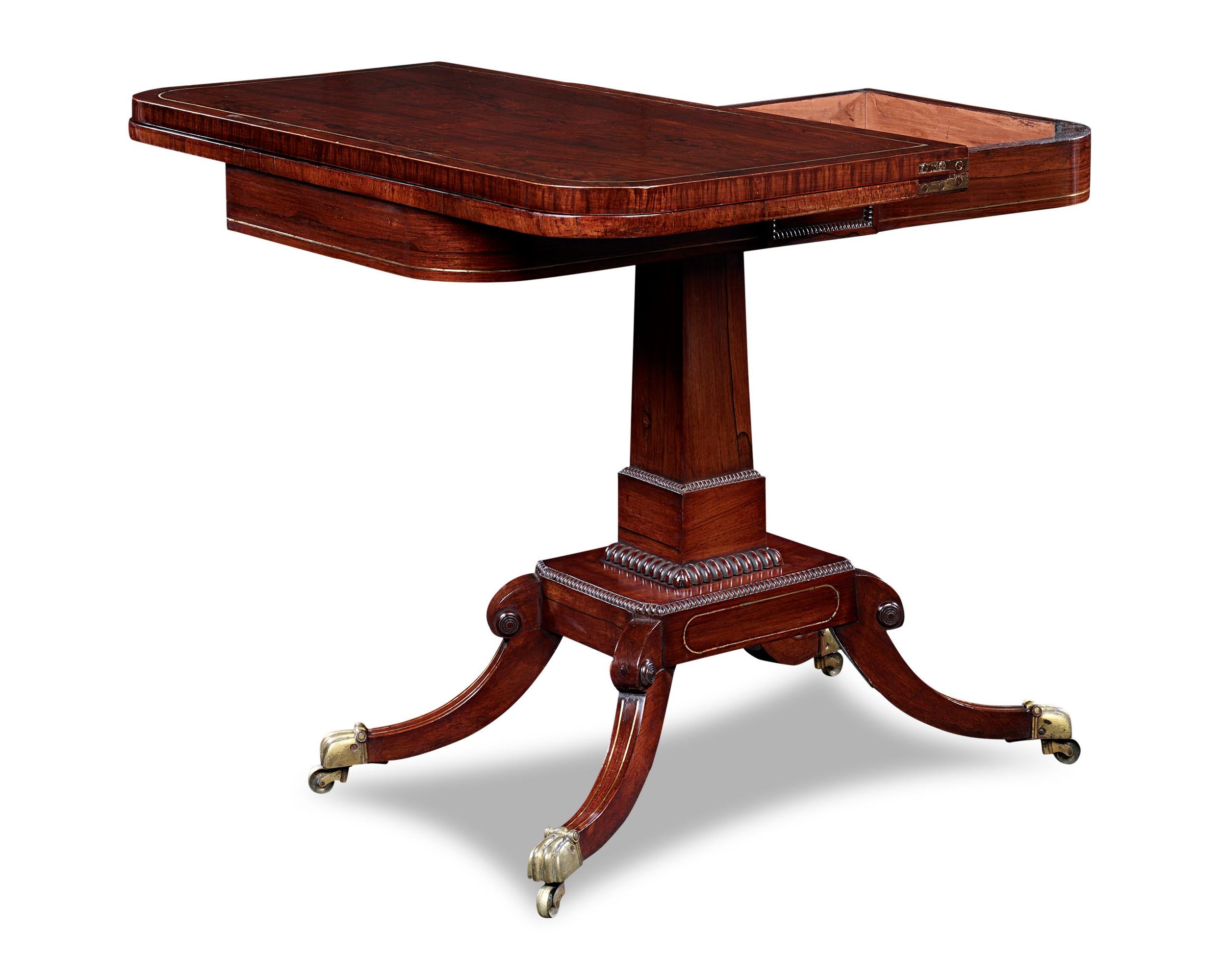 This ingenious late Regency card table was designed with both beauty and entertainment in mind. When not in use, its folded D-shaped top sits against the wall providing an elegant side table. When the time comes to play a game of cards, the tabletop