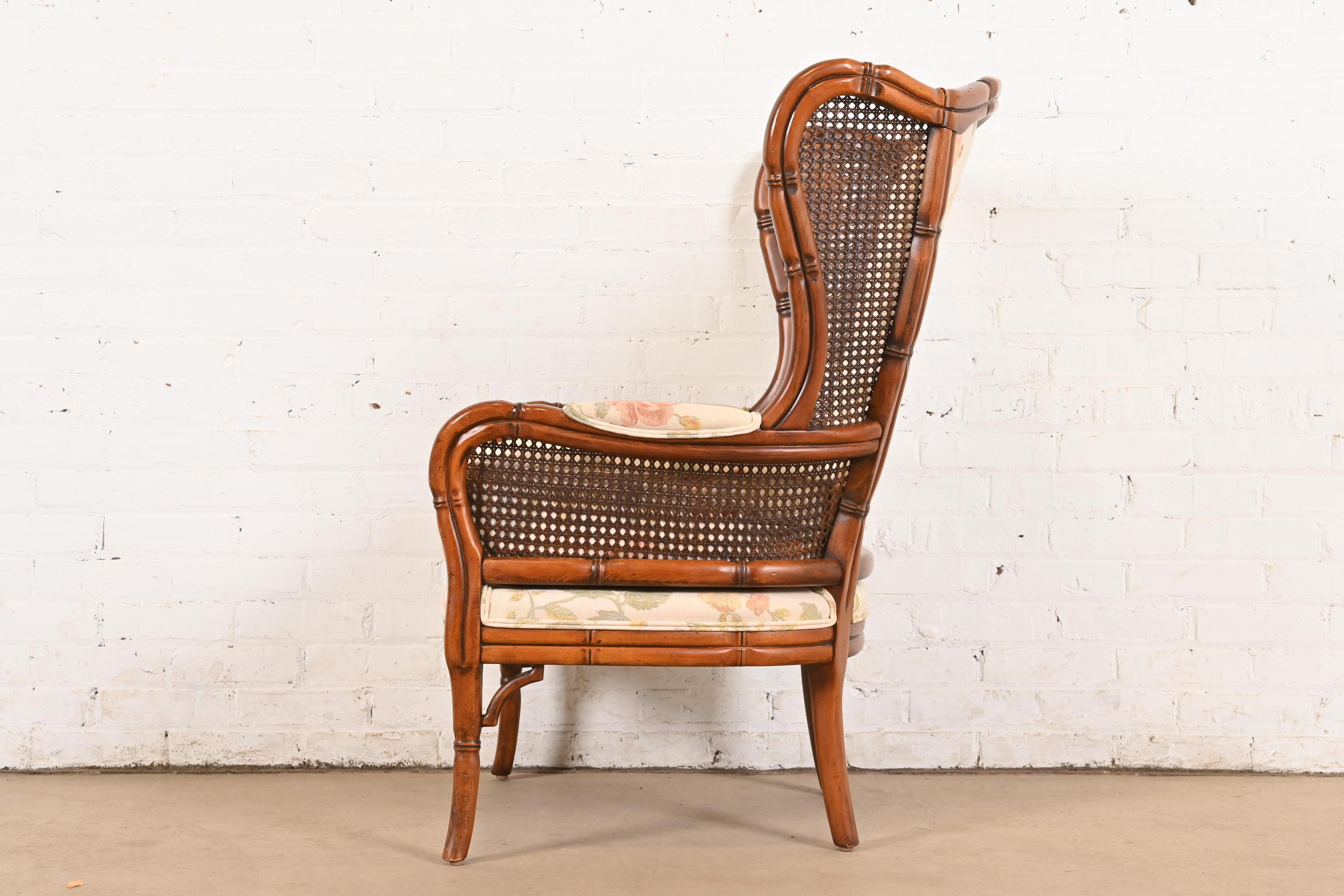 Regency Faux Bamboo and Cane Wingback Upholstered Lounge Chair For Sale 4
