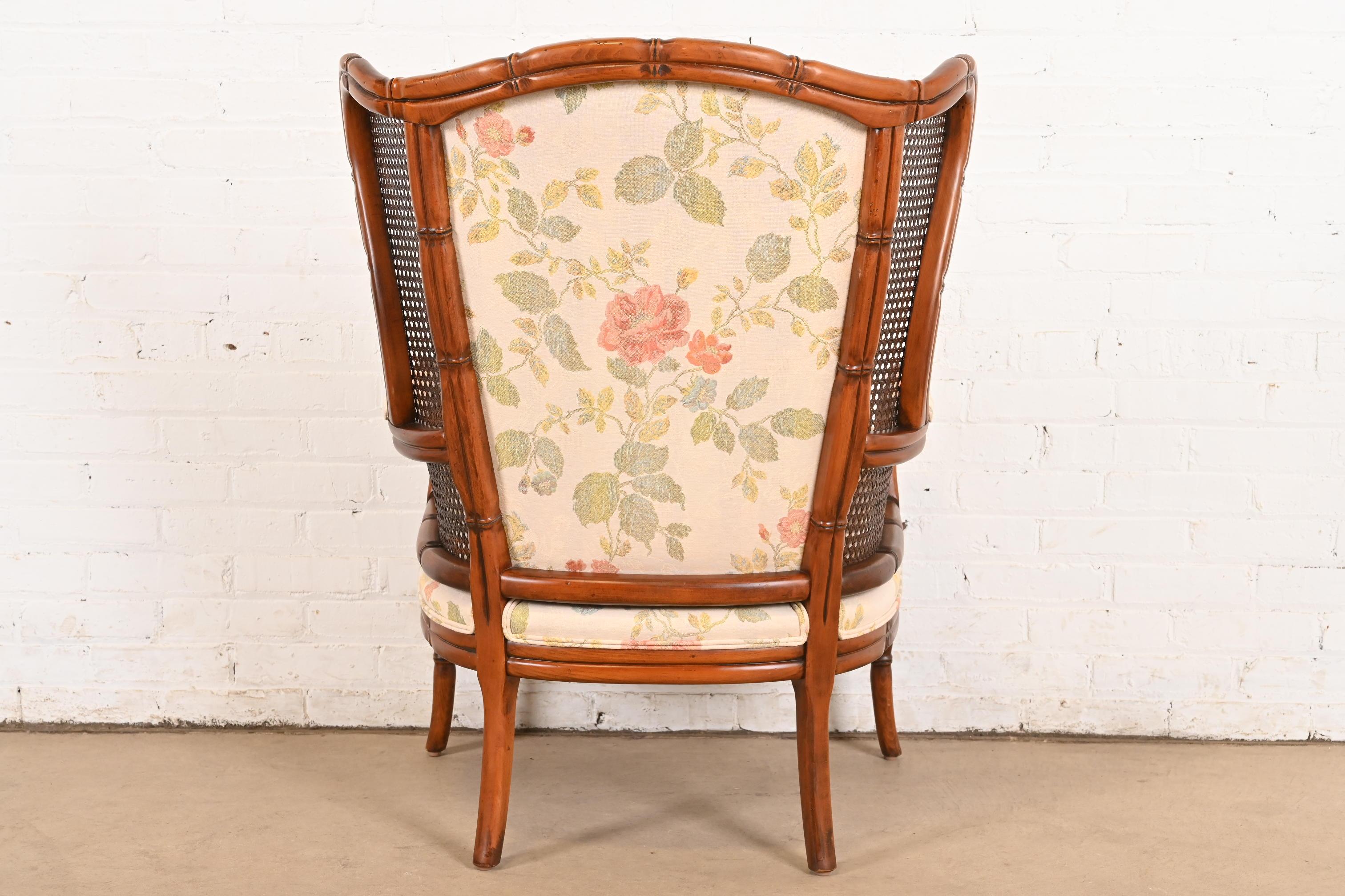 Regency Faux Bamboo and Cane Wingback Upholstered Lounge Chair For Sale 5