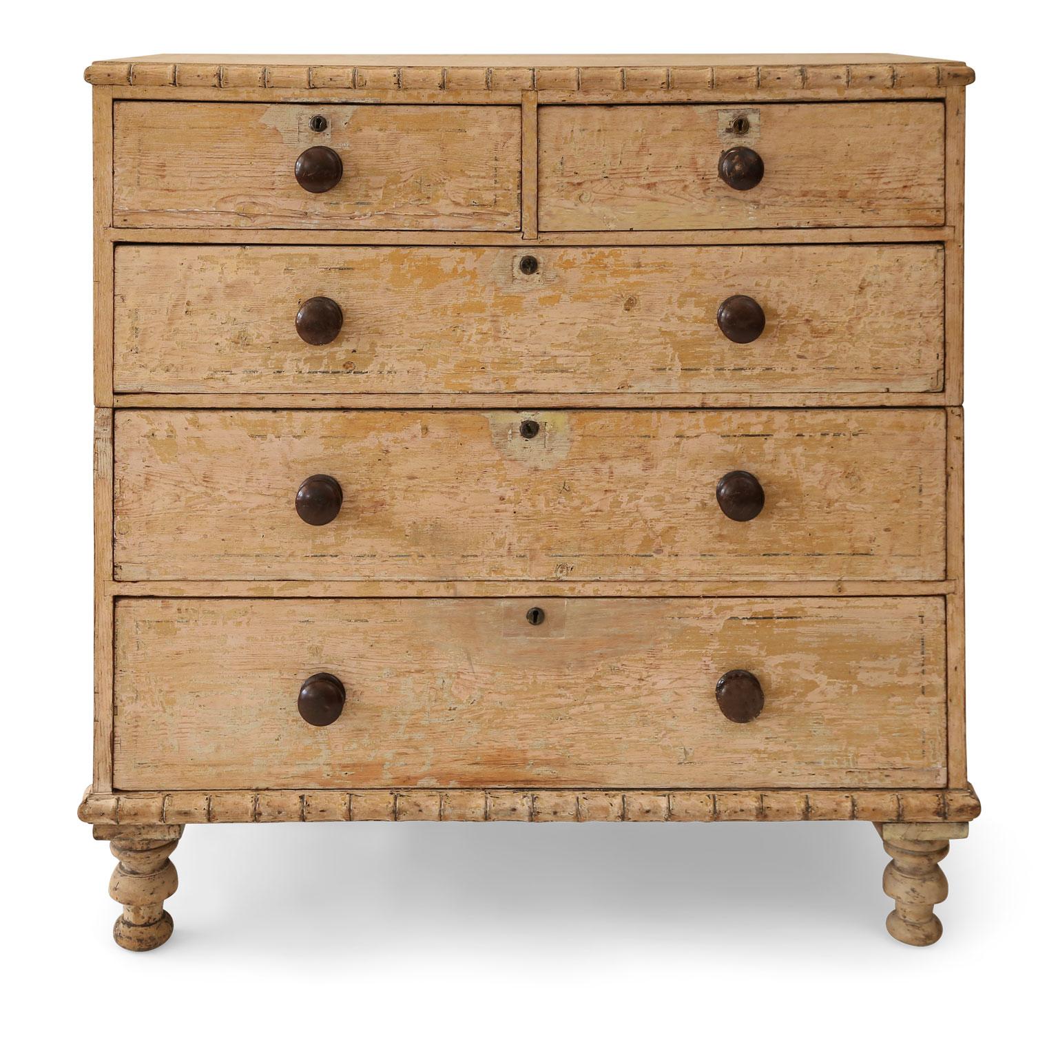 Ocher painted Regency faux bamboo chest, adorned in carved faux bamboo trim-work and scraped back to original ochre paint and line decoration. Contains five drawers (three lower full-width drawers and two upper side-by-side drawers) and rests upon