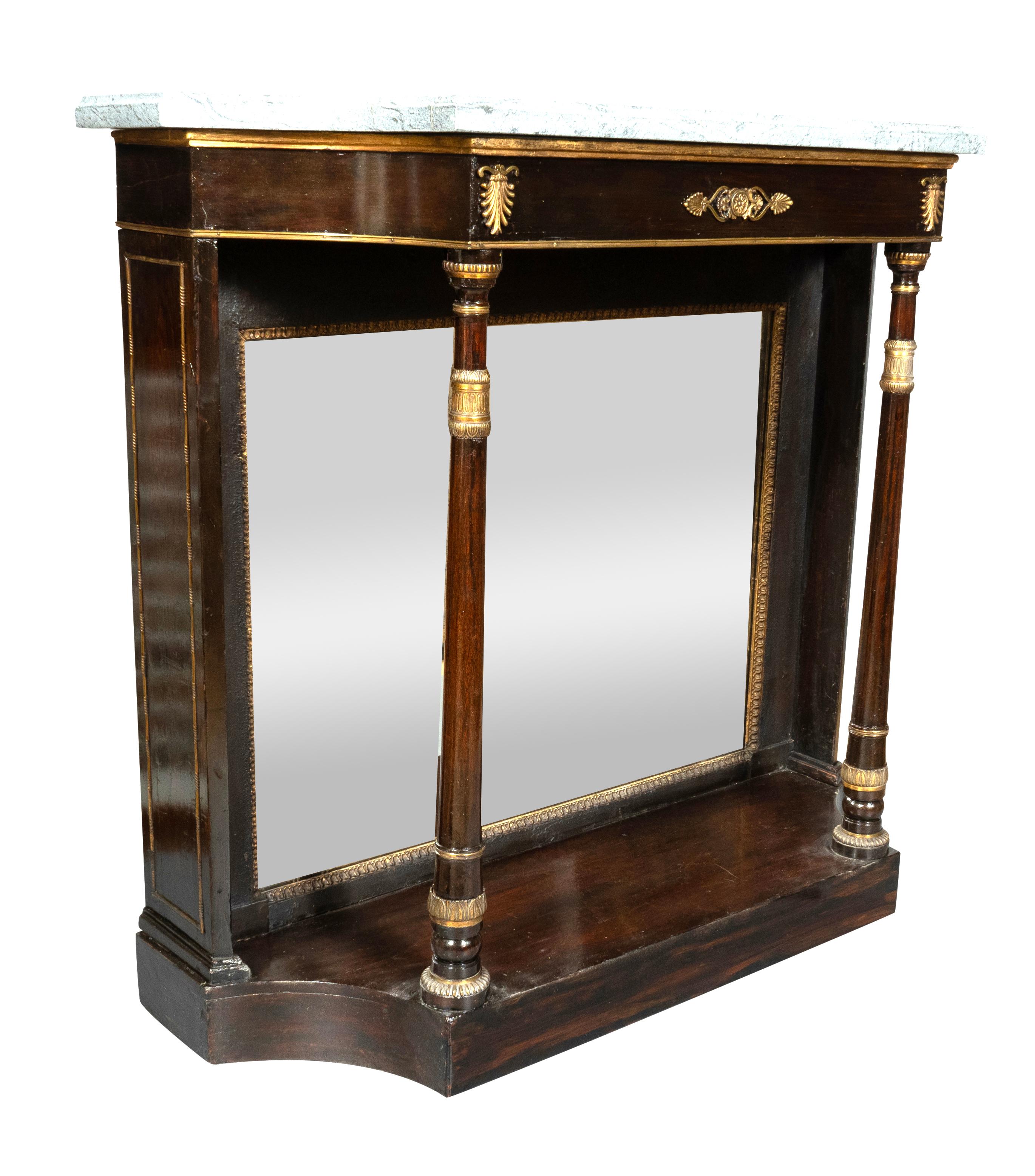 Rectangular gray marble top with curved ends over a conforming brass mounted frieze supported on two columns joining a conforming plinth base.