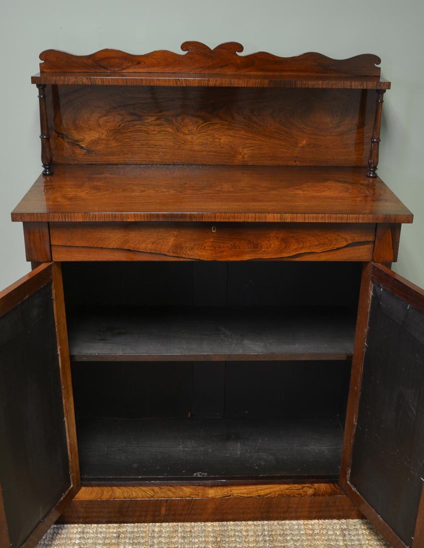 Spectacular Regency figured rosewood mirrored antique chiffonier / cupboard

Constructed from the most spectacular figured rosewood, This stunning chiffonier / cupboard dates from circa 1830. With a raised shaped back and small shelf and